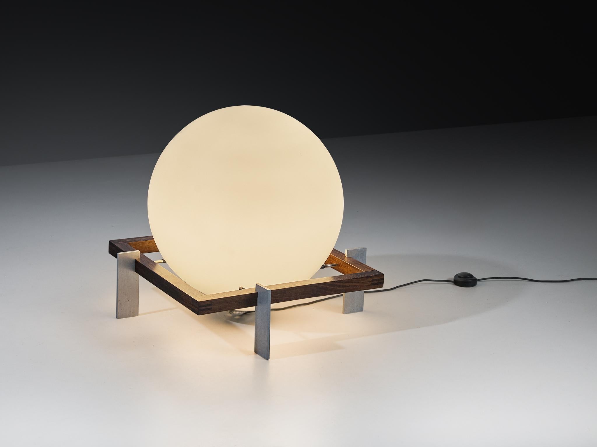 Ton A.C. Alberts for RAAK Amsterdam, 'Zodiac' floor lamp, glass, wengé, metal, the Netherlands, 1970s

This exceptional floor lamp, designed by Ton A.C. Alberts for RAAK Amsterdam in 1974, is a striking example of modern lighting. Known as model