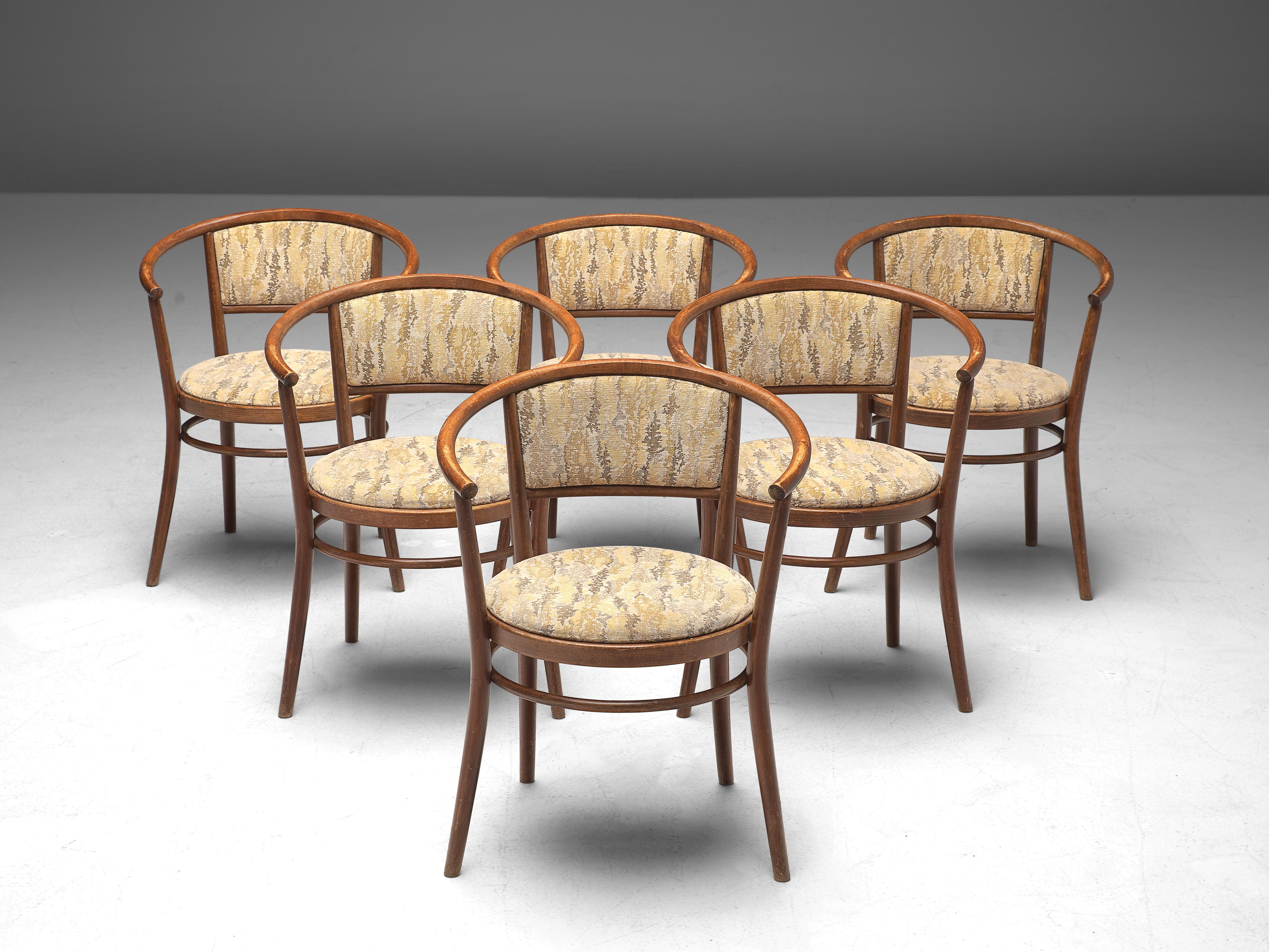 Ton, set of armchairs, bentwood, fabric upholstery, Czech Republic, 1960s

This elegant set of dining chairs, manufactured by Ton, features a wonderful bentwood frame. The round shape of the backrest surrounds the user. The seat and backrest are