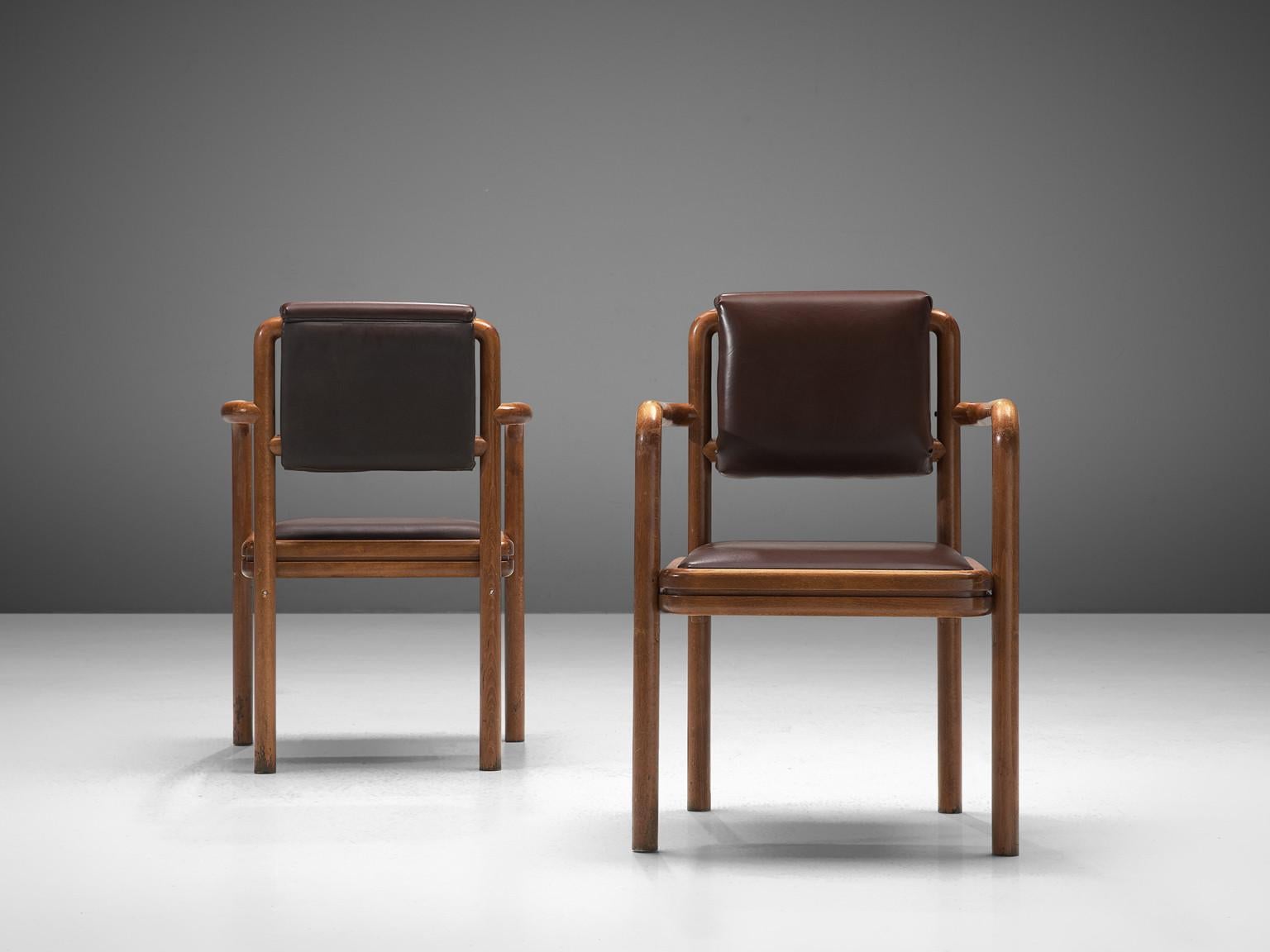 Ton, pair of armchairs, stained beech, leatherette, Czech Republic, 1960s. 

This delightful pair of armchairs is characterized by a bentwood frame featuring elegant round corners and clear lines. The seat and backrest are upholstered in a