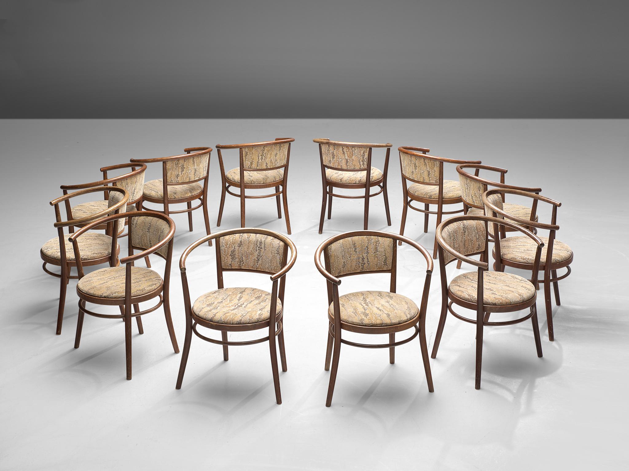Ton, set of armchairs, bentwood, fabric upholstery, beech, Czech Republic, 1960s

This elegant set of dining chairs, manufactured by Ton, features a wonderful bentwood frame. The round shape of the backrest surrounds the user. The seat and backrest