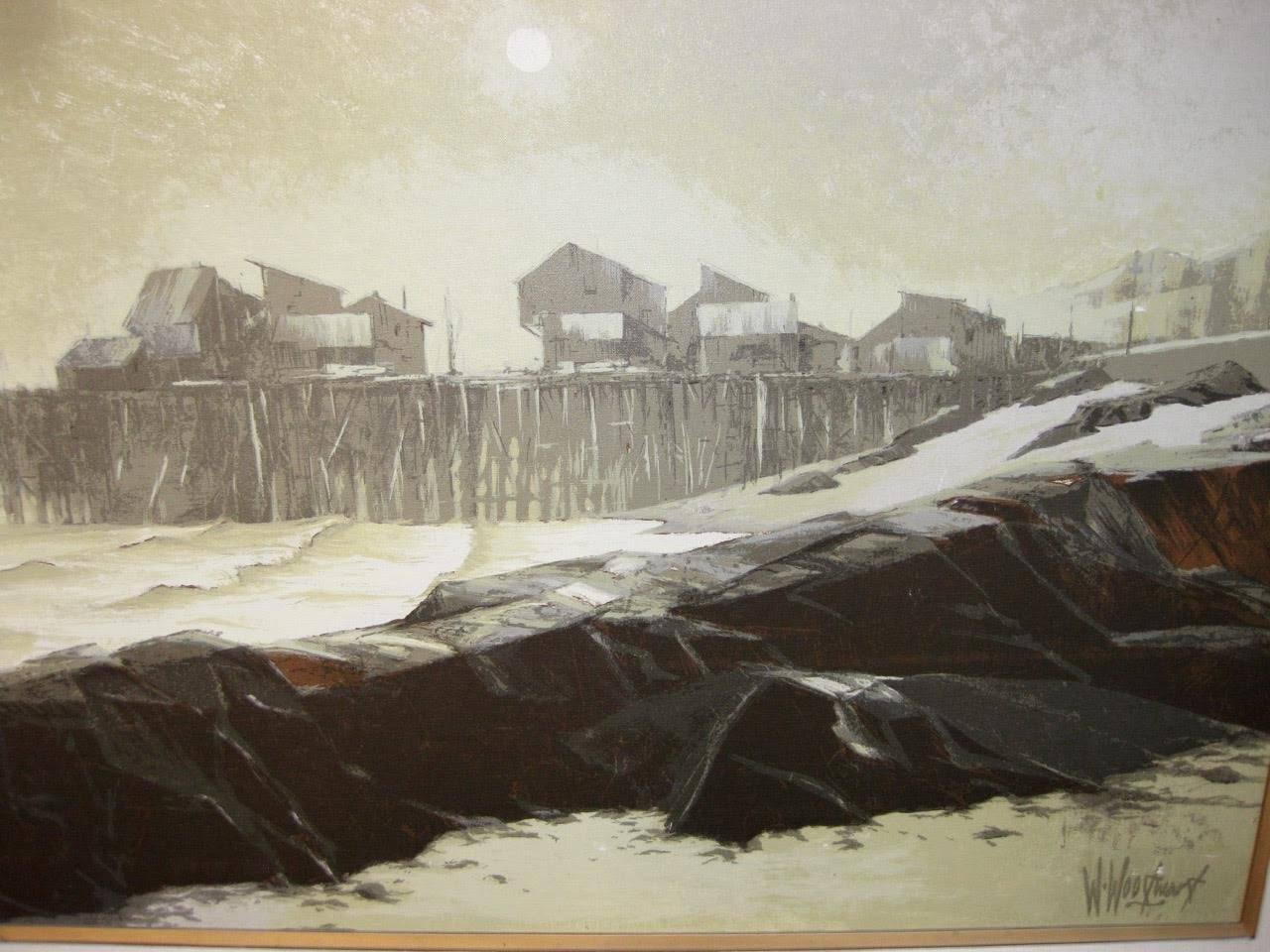 Oil on canvas by W. Woodward. This tonalist painting shows a coastal, fishing pier or cannery, possibly Monterey, California. The painting is done in soothing tones of grey seafoam, sage green, and fawn, with charcoal colored rocks in the