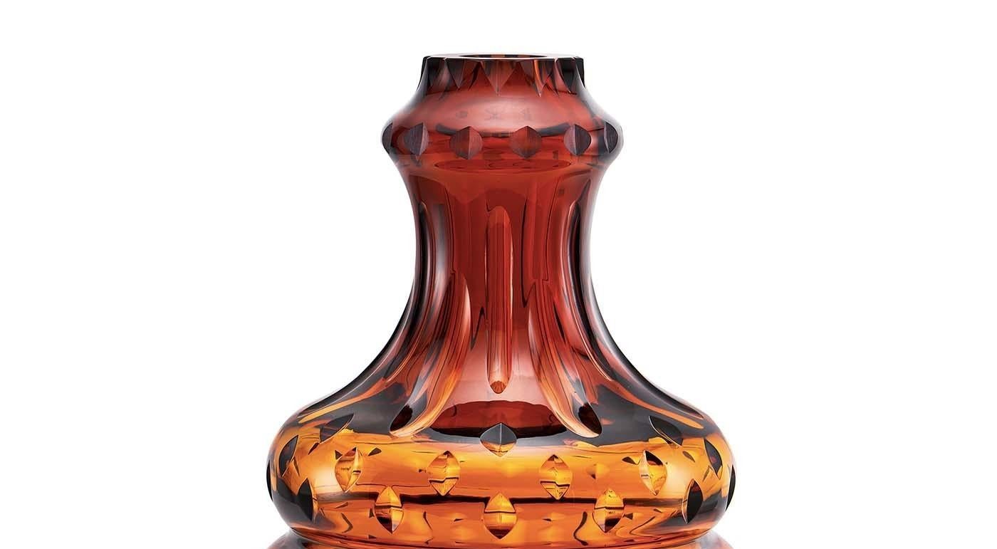 Part of the Boboda collection of sinuous crystal vases, this piece is named Passion and, along with Love and Power, forms a trio of strong visual impact. The sensual curves of the vase are tinted in a delicate cognac hue that will lend elegant charm