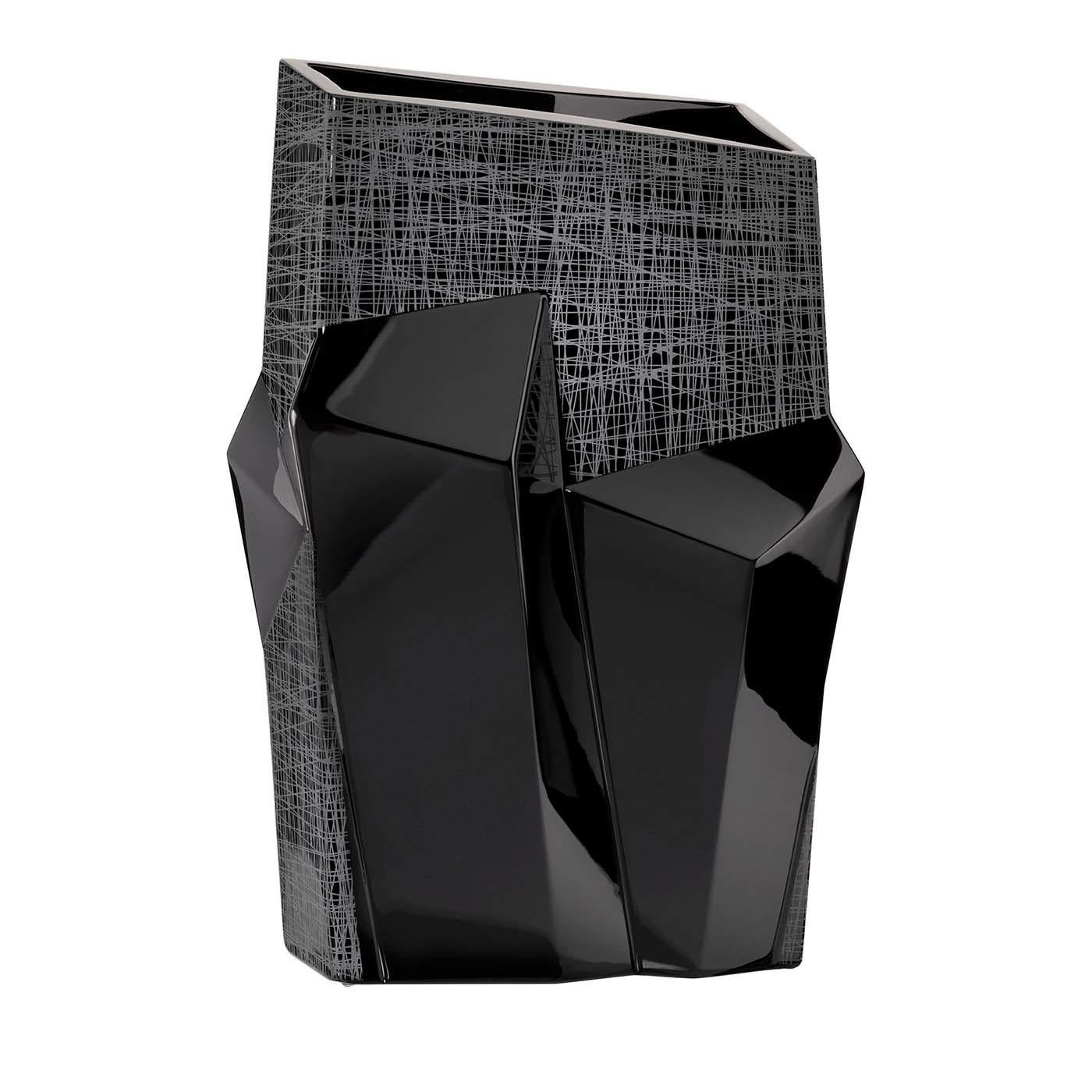 This stunning vase was crafted entirely of black crystal and its unique volumes are a celebration of Expressionist art. Dynamic and intriguing, the asymmetrical lines of this silhouette seem to have been pushed forward by an inner force with