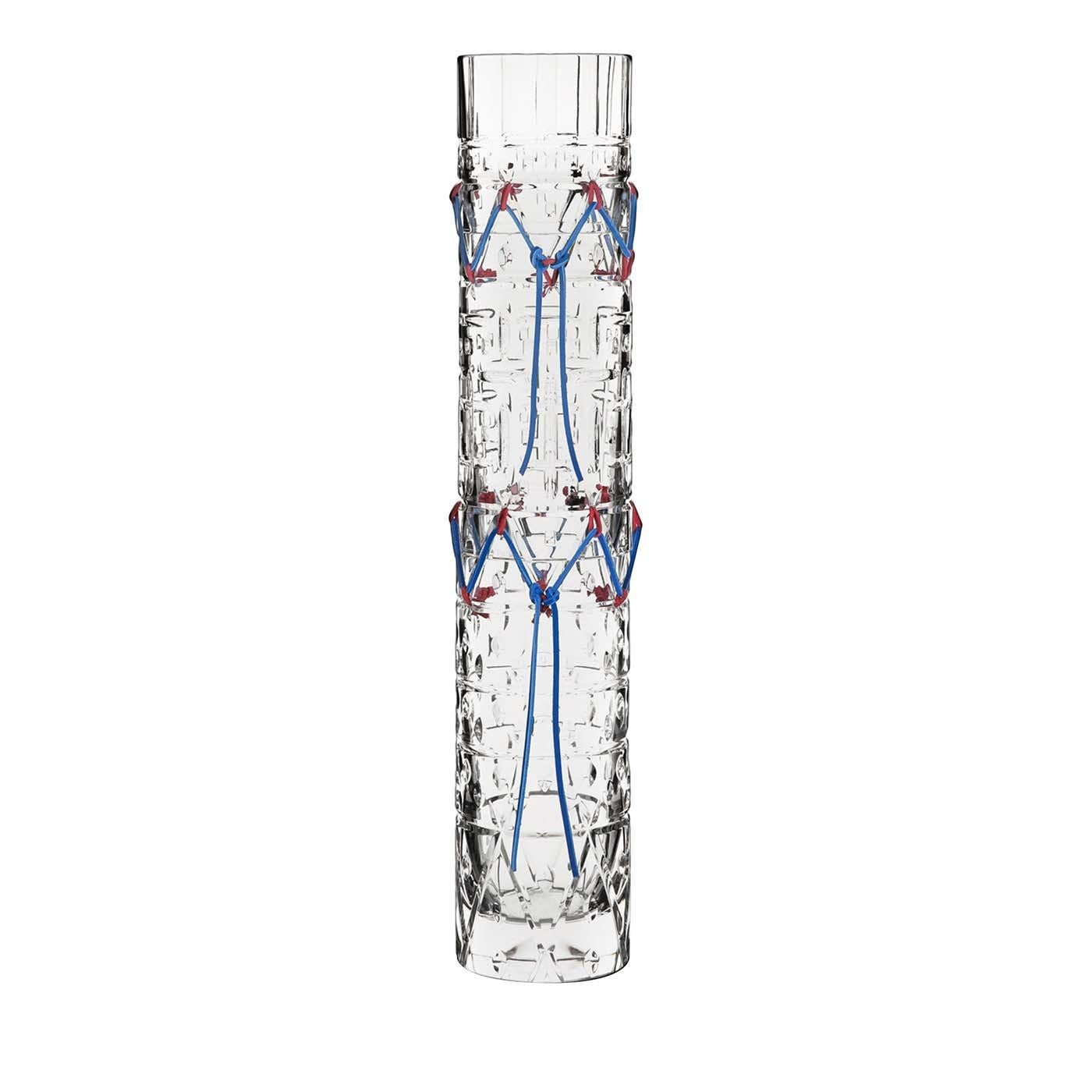 An elegant homage to the iconic aesthetic distinctive of the Native American culture, this vase is crafted of transparent crystal using traditional Italian methods, creating a superb mix of two different sensibilities. The elongated conical shape of