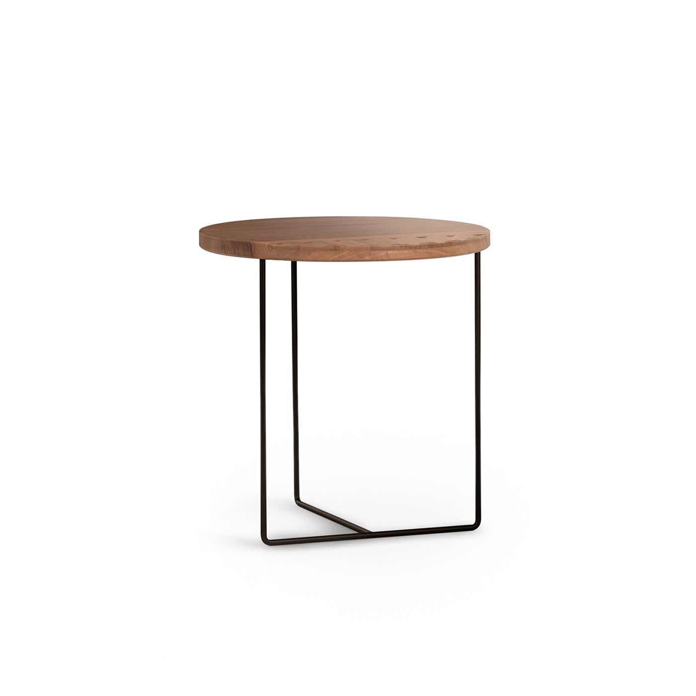 An exquisite work of craftsmanship by Davide Aquini, this side table is composed of a Minimalist three-leg structure made of reinforced steel finished with an iron black lacquer. The round top is made of solid walnut whose 1/3 of its surface boasts