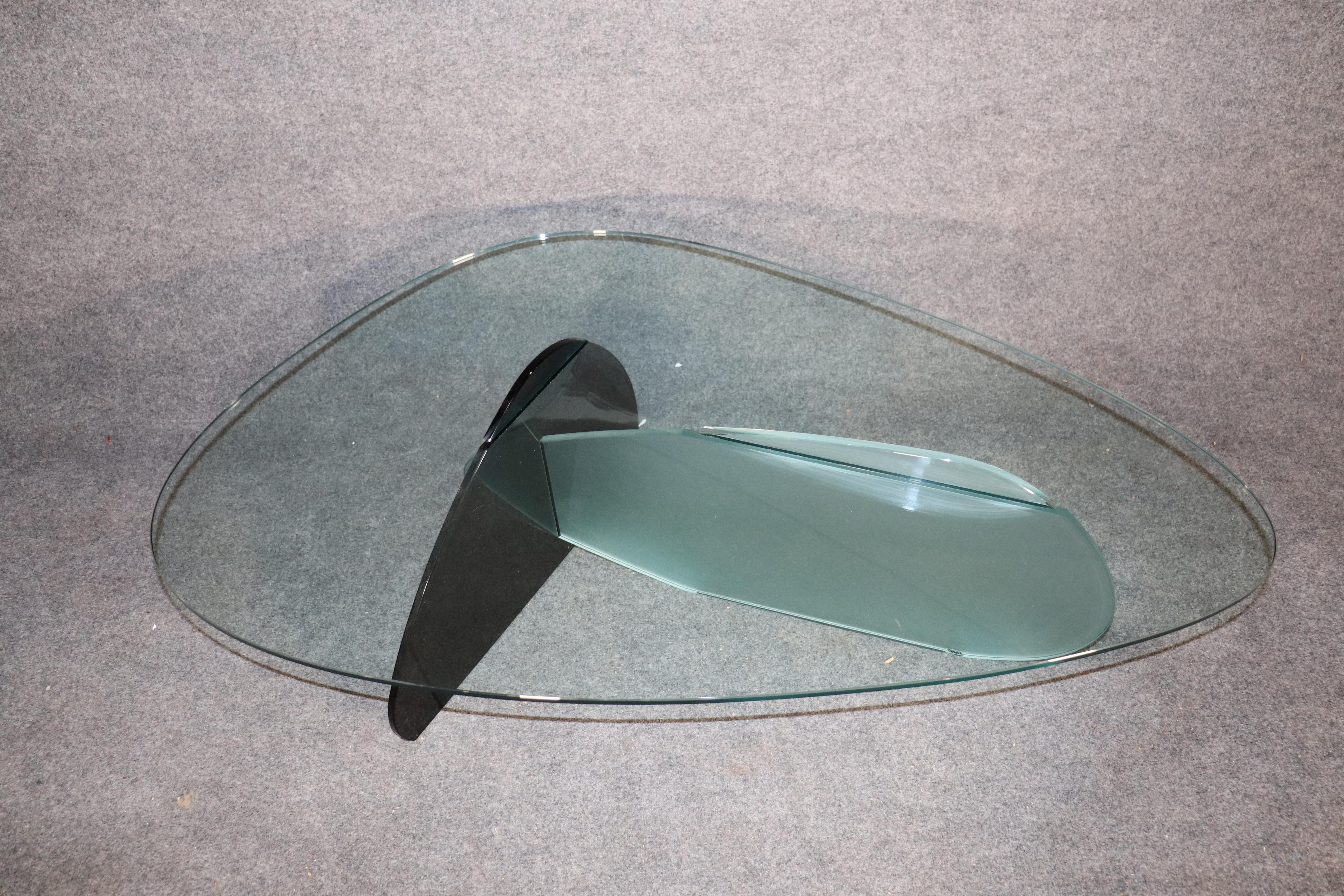 Mid-century style glass table with black and frosted glass base.
Please confirm location.