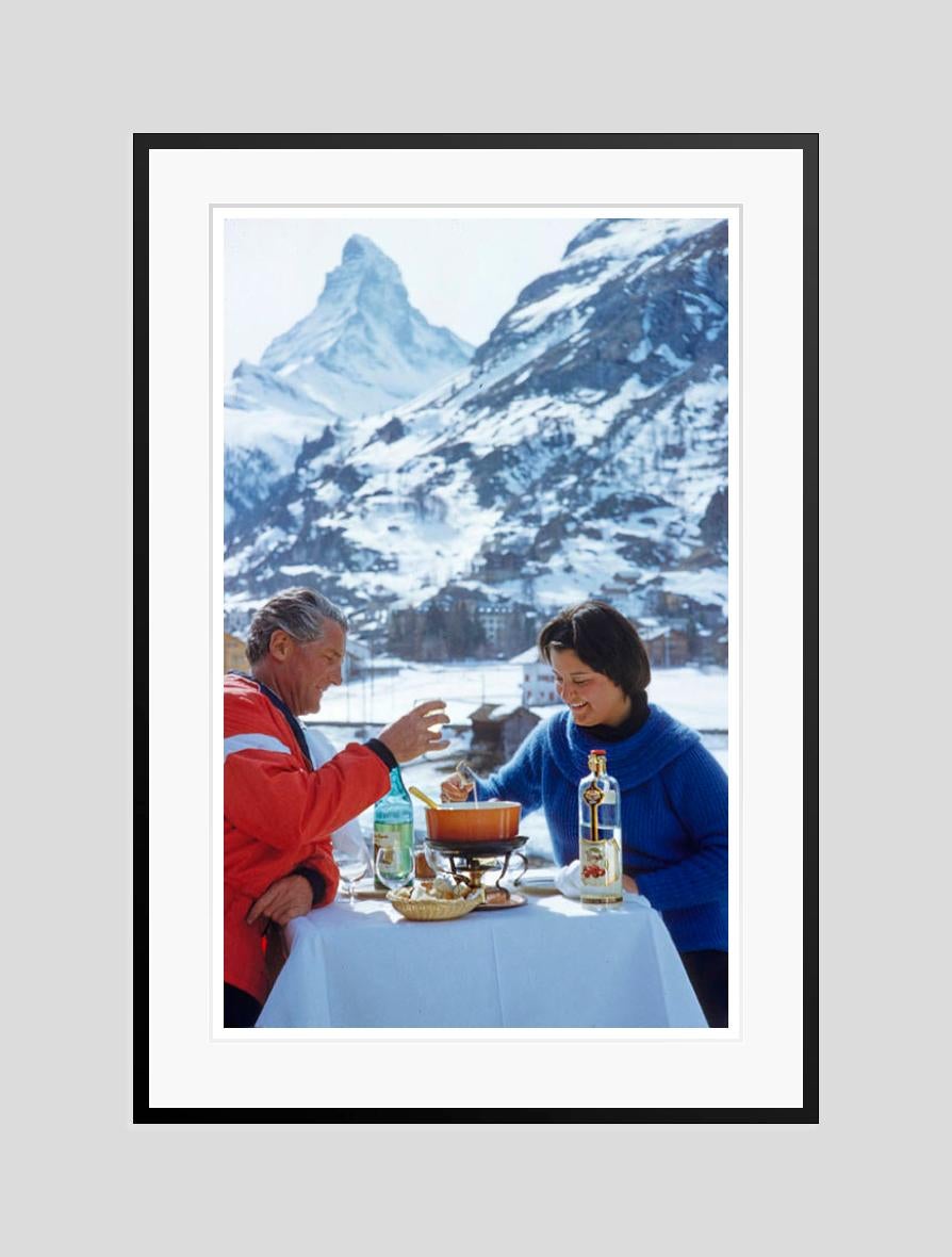 Apres Ski Time 

1959

A couple enjoy an après-ski fondue with the Matterhorn in the background, 1959. 

by Toni Frissell

12 x 16