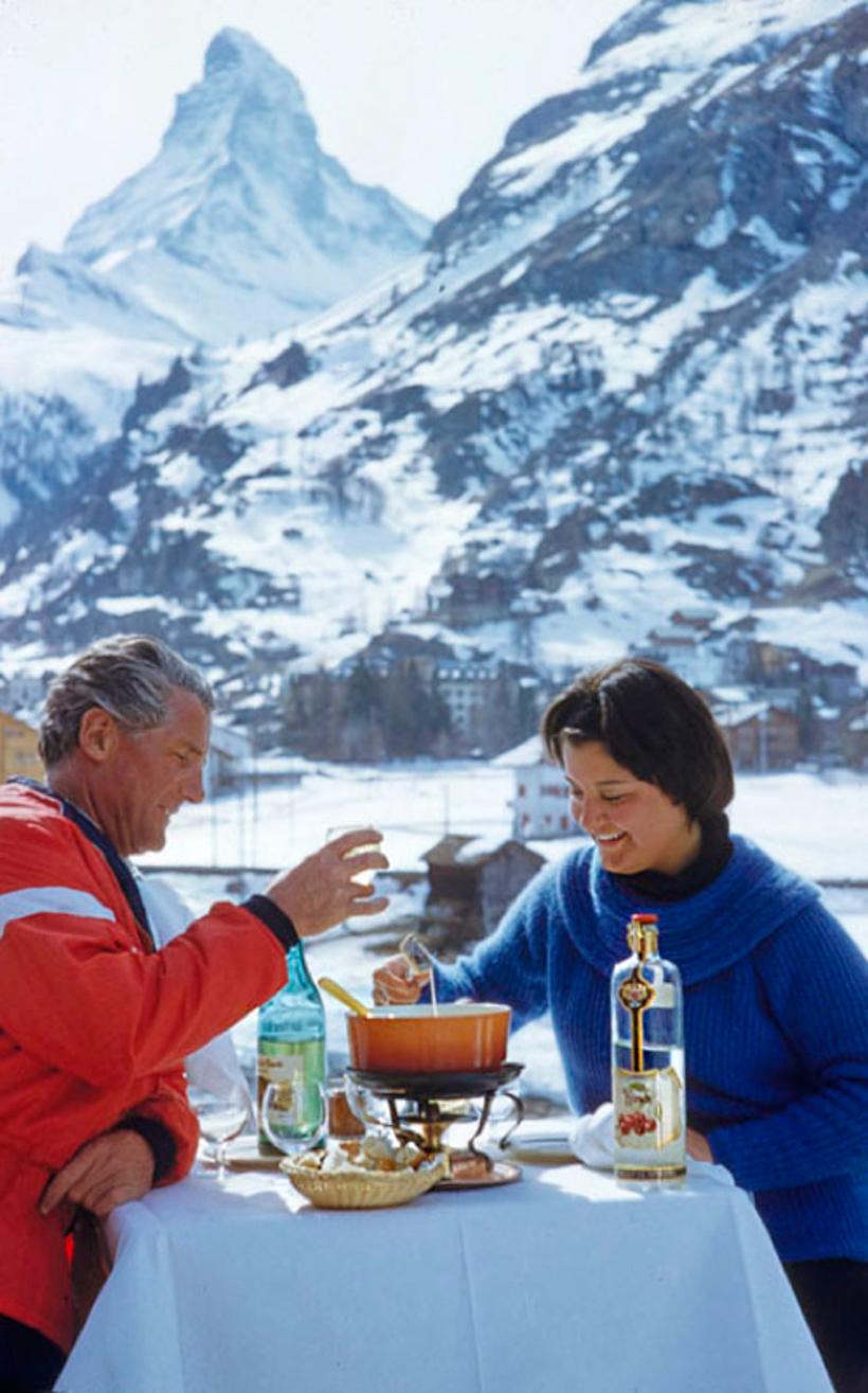 Apres Ski Time 
1959

A couple enjoy an après-ski fondue with the Matterhorn in the background, 1959. 
by Toni Frissell

40 x 60" inches / 101 x 152 cm paper size 
Archival pigment print
unframed 
(framing available see examples - please enquire)