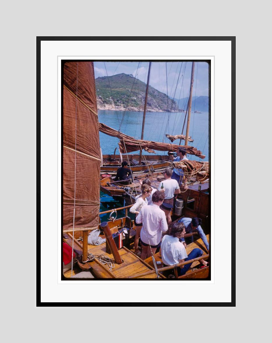 Drinks Time 

1959

Tourists enjoying a drink aboard a traditional junk in Hong Kong harbour, 1959.

by Toni Frissell

12 x 16