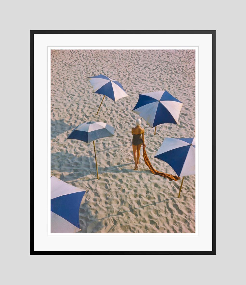 Girl On The Beach

1948

Beachwear fashion shoot featuring sunshades, 1948

by Toni Frissell

16 x 20