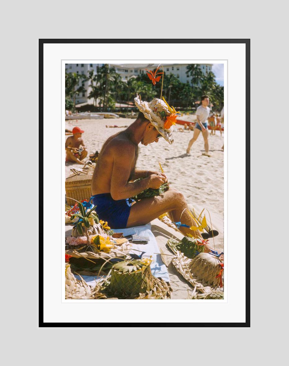Hawaiian Scenes 

1957

A man weaves sun hats on a Hawaiian beach, 1957.

by Toni Frissell

16 x 20