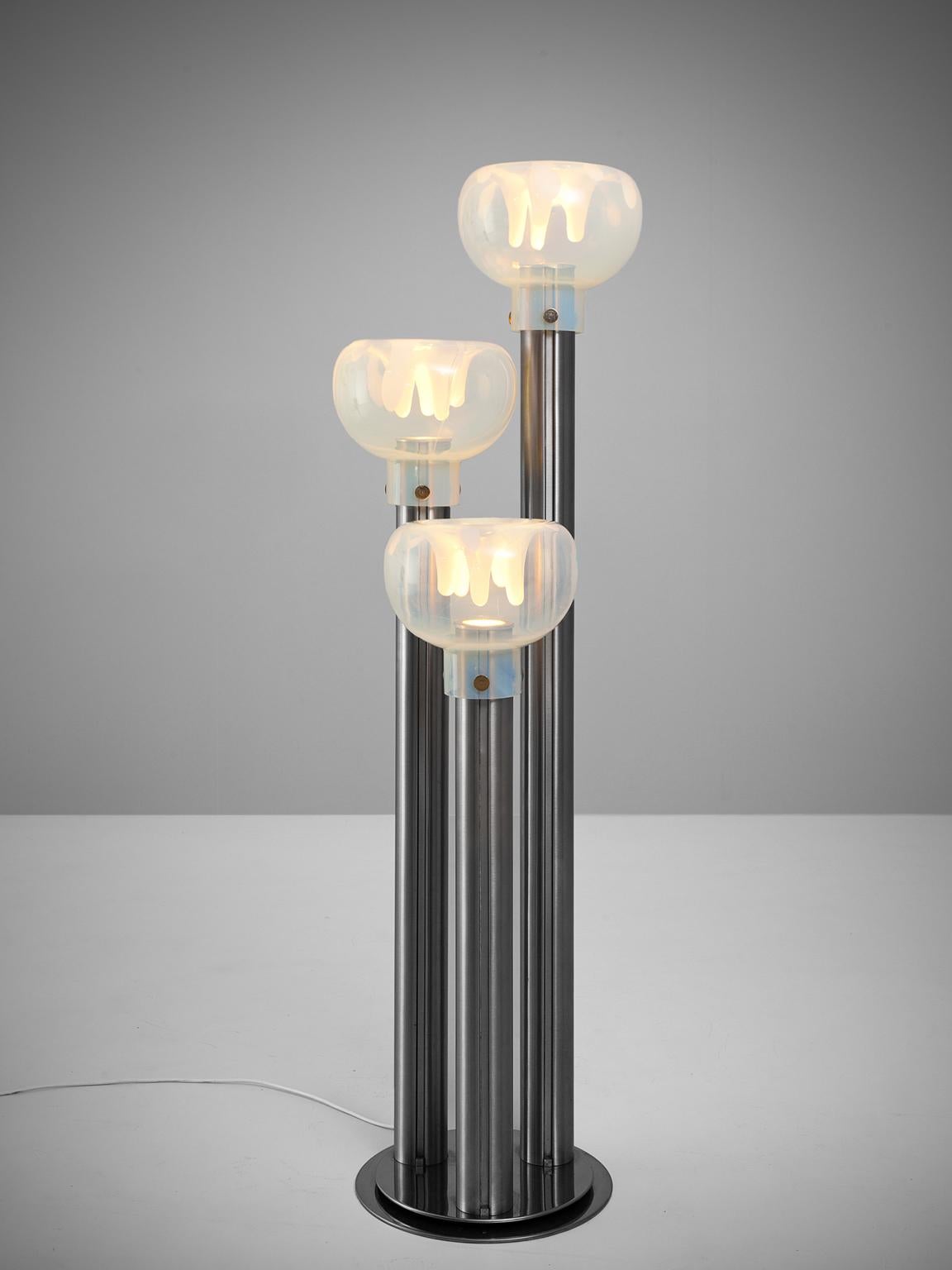 Toni Zuccheri for VeArt floor lamp, Murano glass and stainless steel, Italy, circa 1970s. 

This very unique lamp is particular for it's globes as they make a unique lighting effect. These three lights stand on steel poles which keep up the half