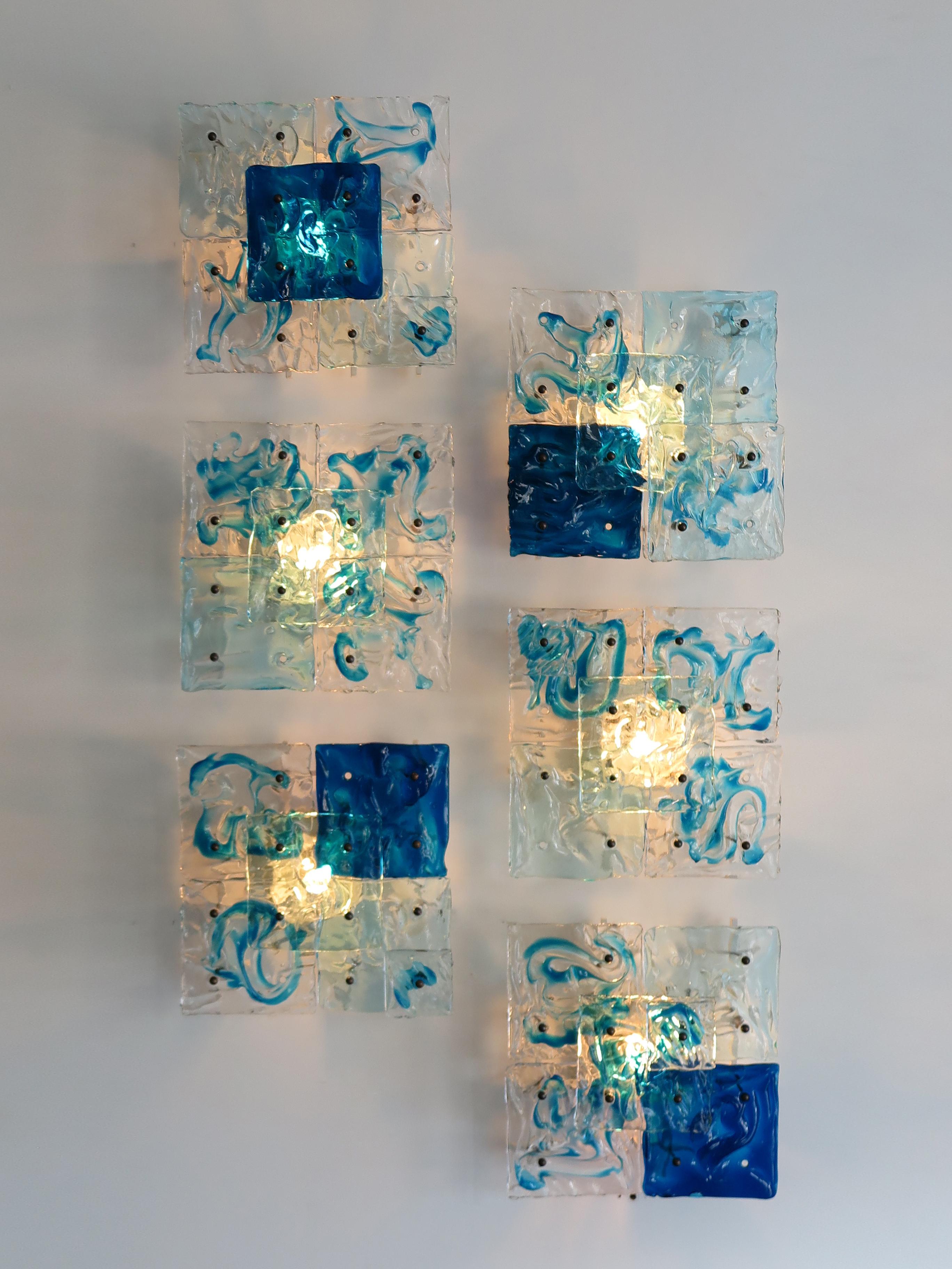 Set of amazing and very rare and luxury Italian wall lights or sconces designed by Toni Zuccheri and produced by Venini Murano, model Patchwork, hot-worked transparent glass, painted metal frame and brass details, 1970s.
Venini Murano brand
