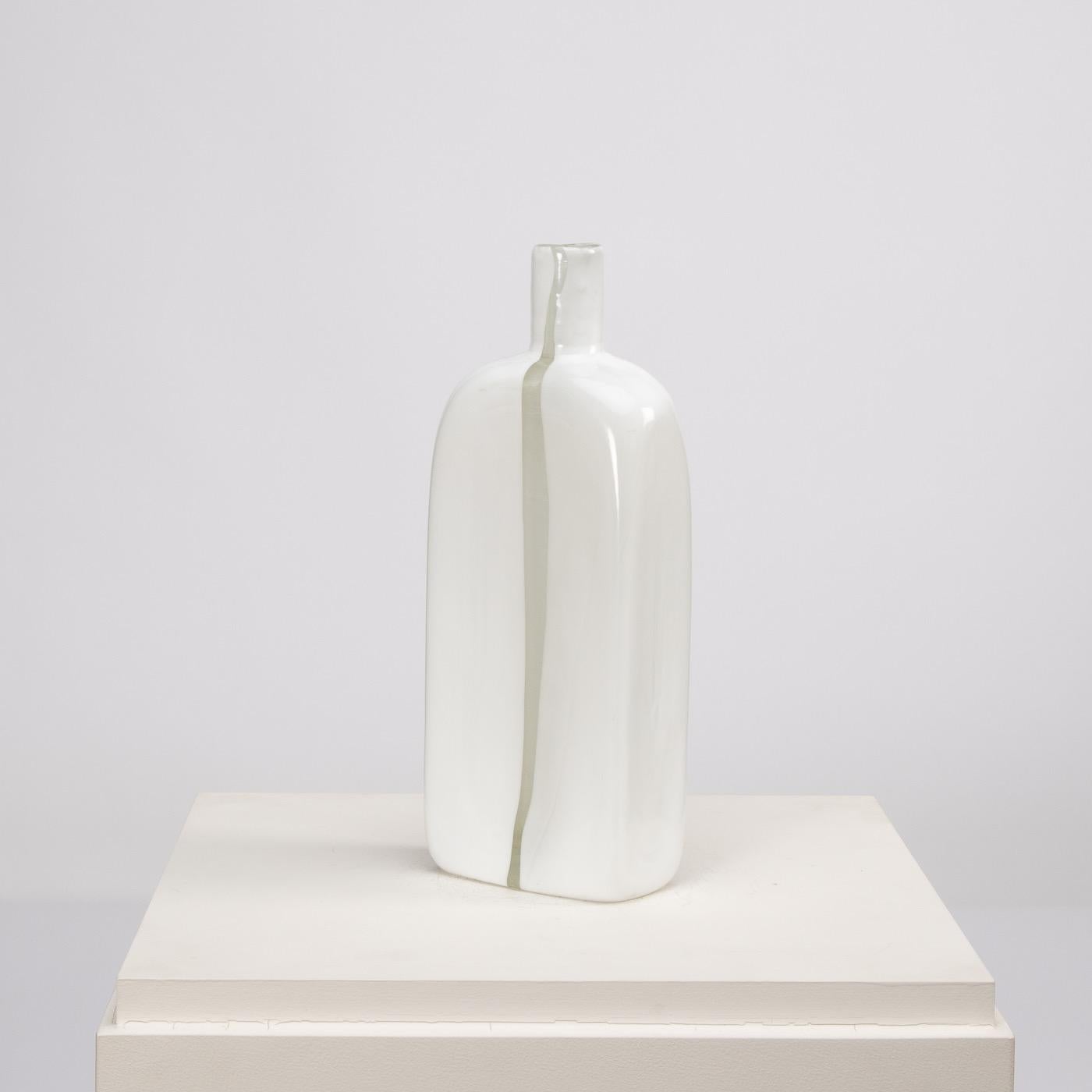 White monochrome blown glass submerged in clear glass, clear glass window.
Shaped as a bottle. 
Designed in 1966, example of the series exhibited at 34th international Art Exhibition in Venice in 1968. 
Diamond point signature 