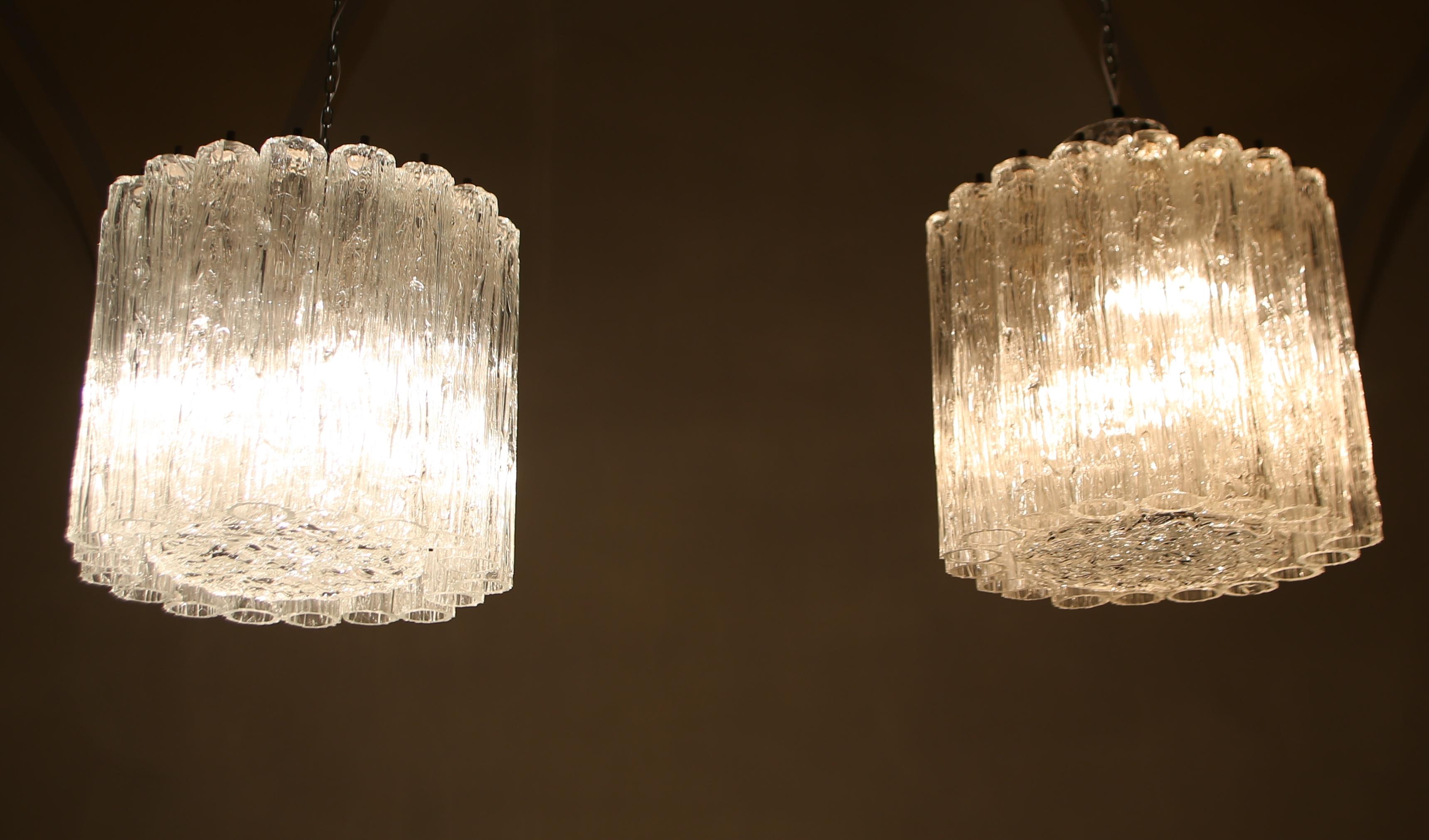 TONI SUGAR.
Pair of glass and brass chandeliers from the 