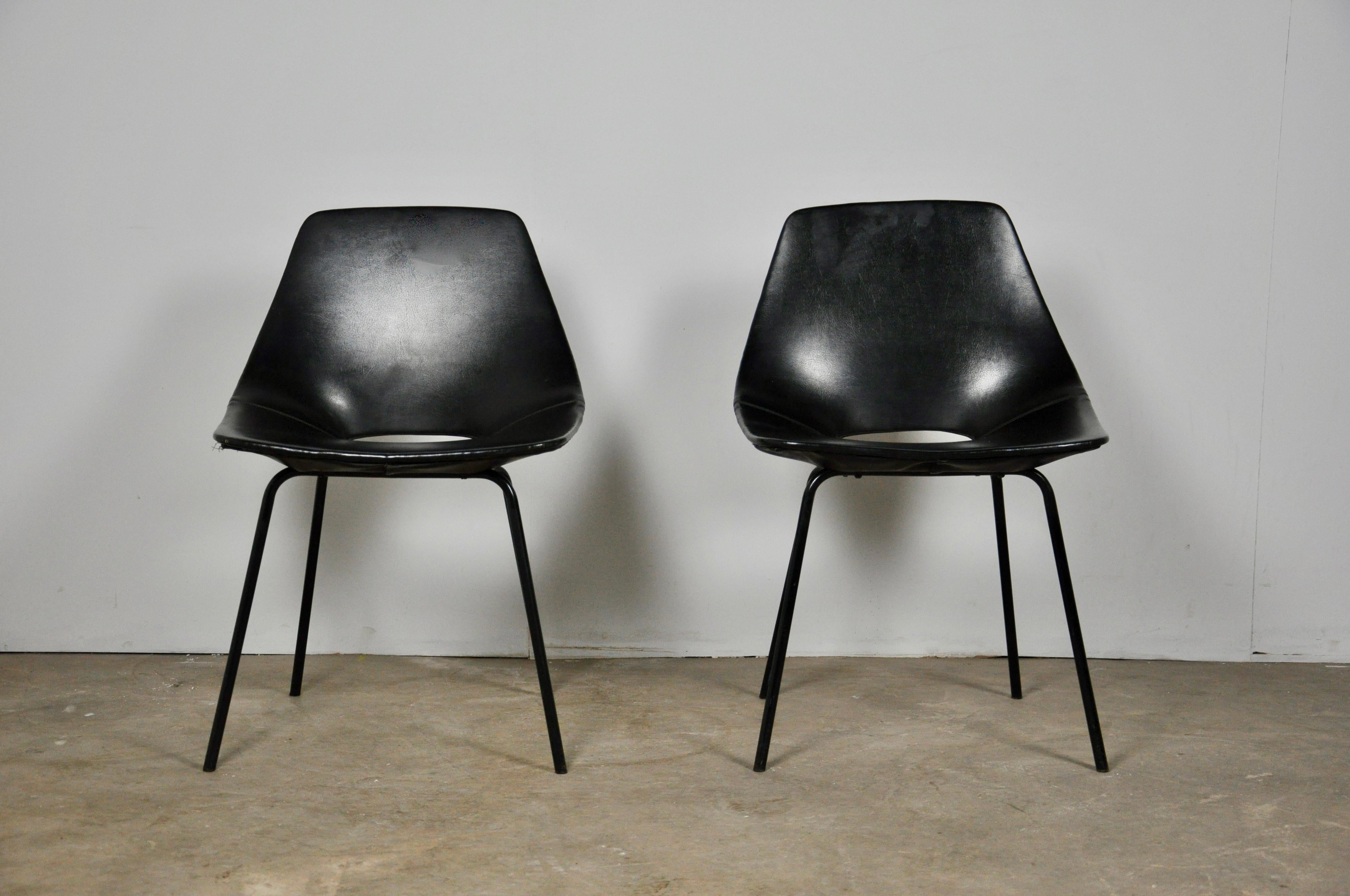 Set of two black leather chairs. stamped STEINER under the seat.