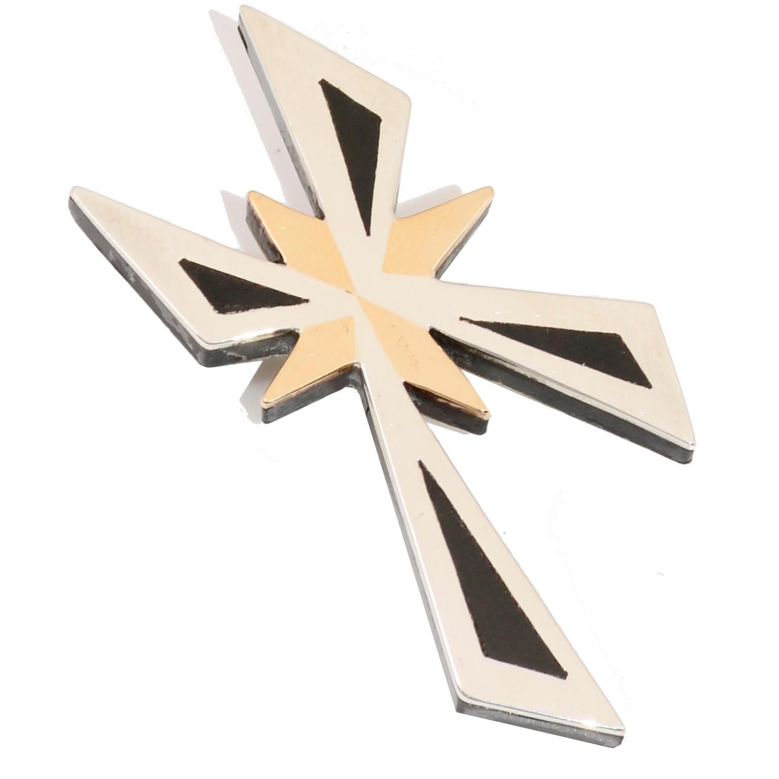 This is a lovely mixed metal sterling silver modernist mid century vintage cross pendant that can also be worn as a brooch. The piece is marked Hecho en Mexico CRA Signed TONO T-20 Sterling 925 Taxco 
Piedra Negra. A light scratch in the brass star