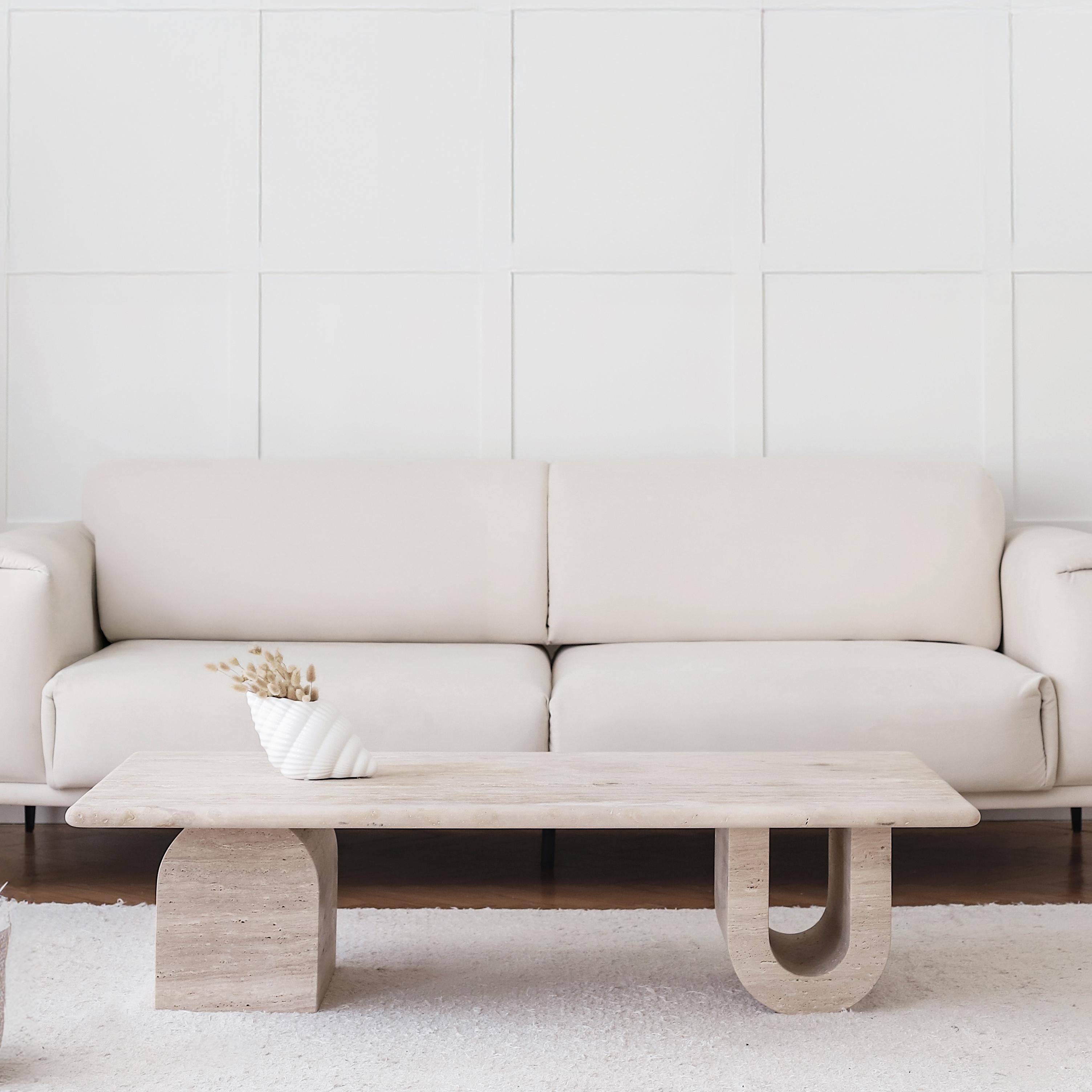 At first glance, the Tonoz Coffee Table reveals the power and beauty born from the combination of simple geometric shapes; it is individually crafted by skilled stone artisans without the use of any filling material for a raw and textured
