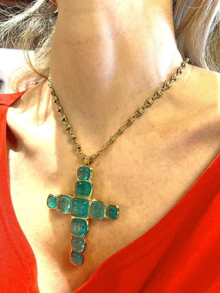 gold cross necklace with emerald stone