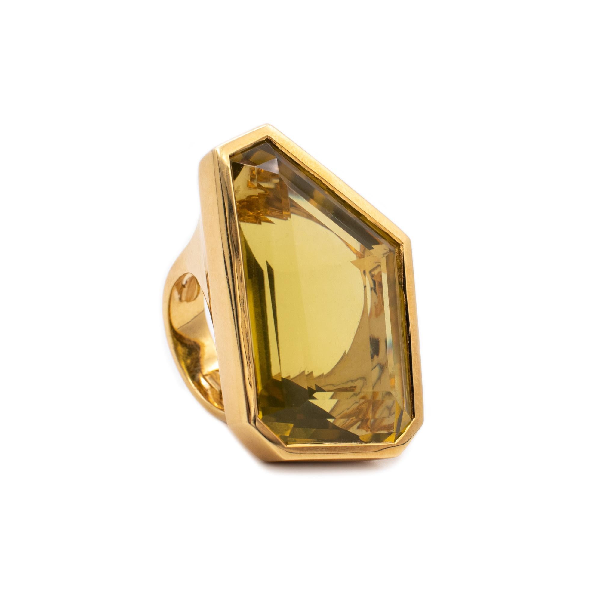 Bold geometric ring designed by Tony Duquette (1914-1999).

A rare and gorgeous vintage piece, created by the American designer Tony Duquette, back in the 1980's. This cocktail ring was carefully crafted, with geometric semi-curved seven sides in