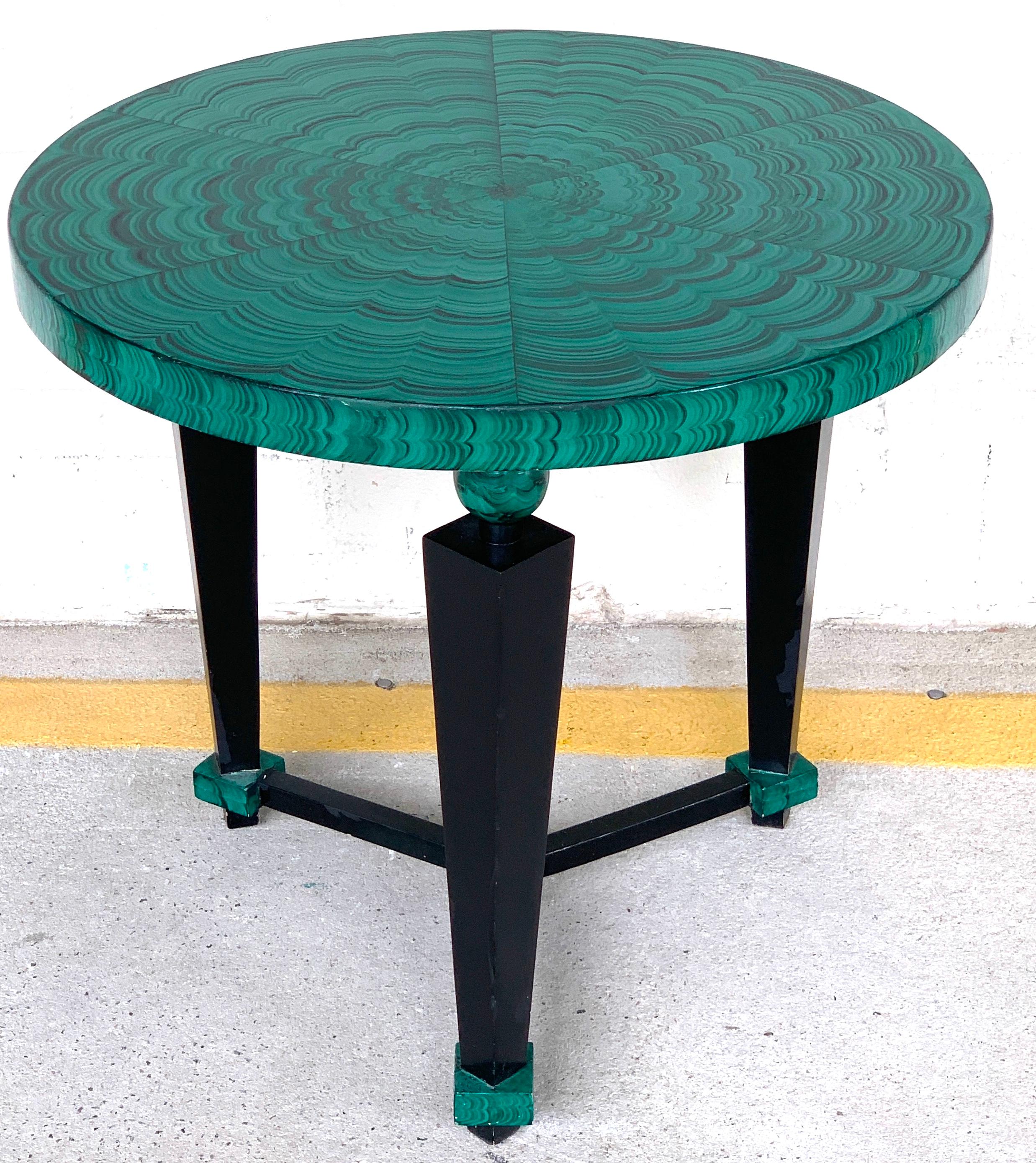 Tony Duquette style faux malachite and ebonized guéridon or side table, with fantastically painted bookmatched malachite circular top, raised on a tripartite tapering column base with center stretcher.