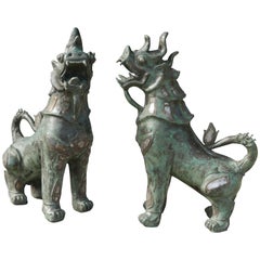 Tony Duquette Style Thai Bronze Foo Dogs Inset with Antique Mirrors and Agate