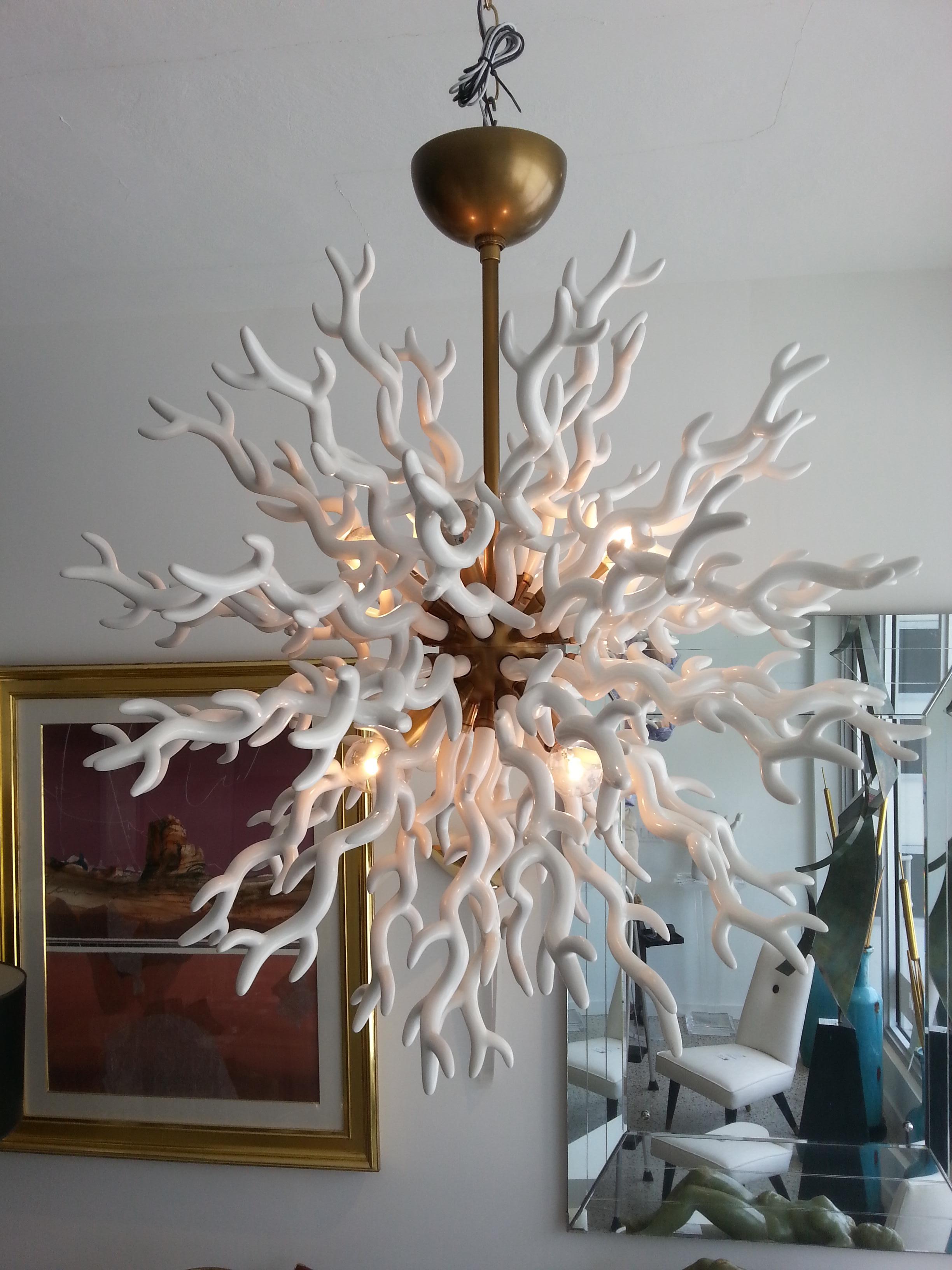 This stylish and chic faux coral chandelier is very much in the style of pieces created by Tony Duquette.

Note: Required eight candelabra based light bulbs.