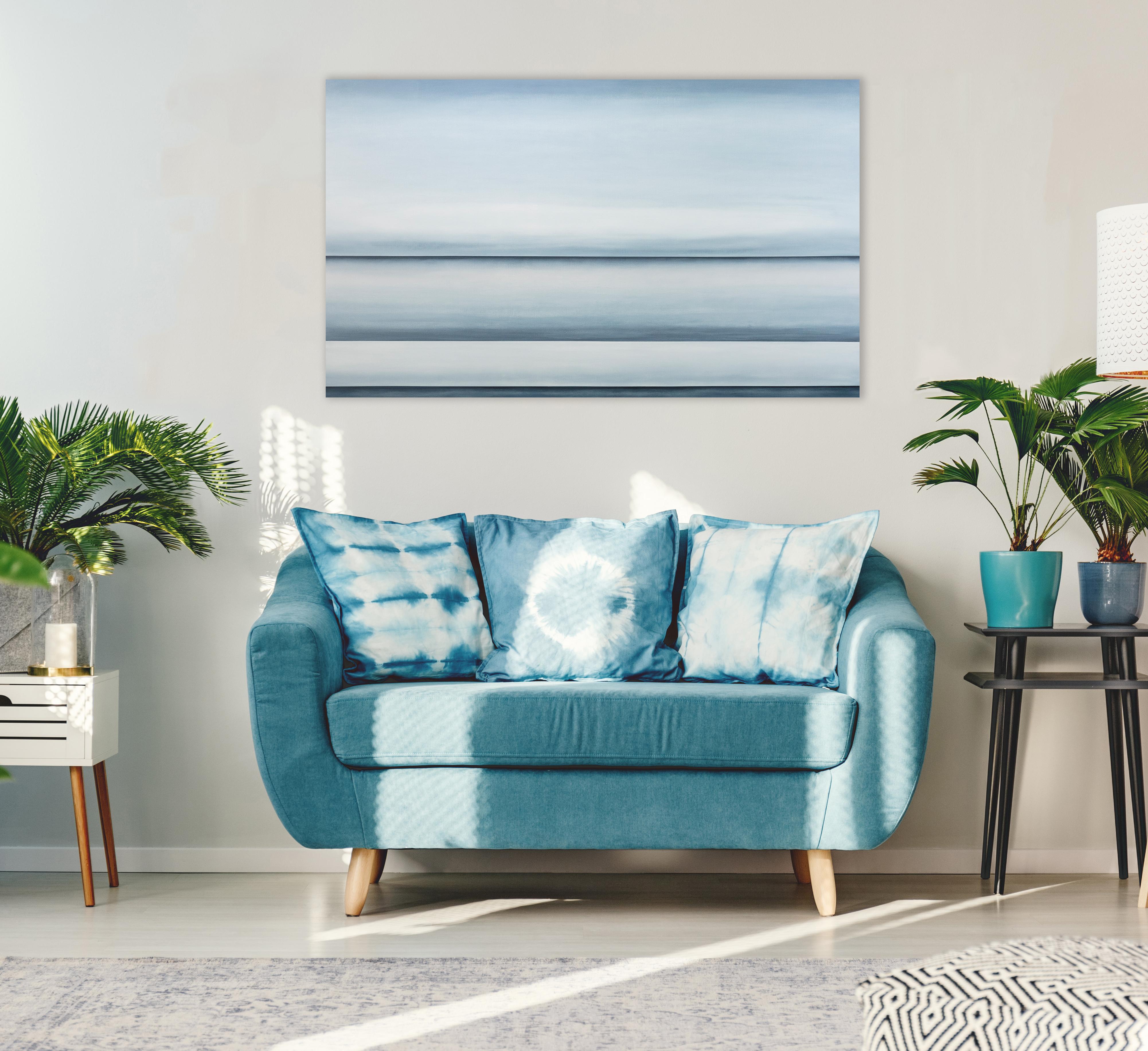 This abstract oil painting by Tony Iadicicco features a blue monochromatic palette. The painting has an abstracted landscape composition, with three stark blue horizon lines running through the canvas and soft blue blended colors between each -