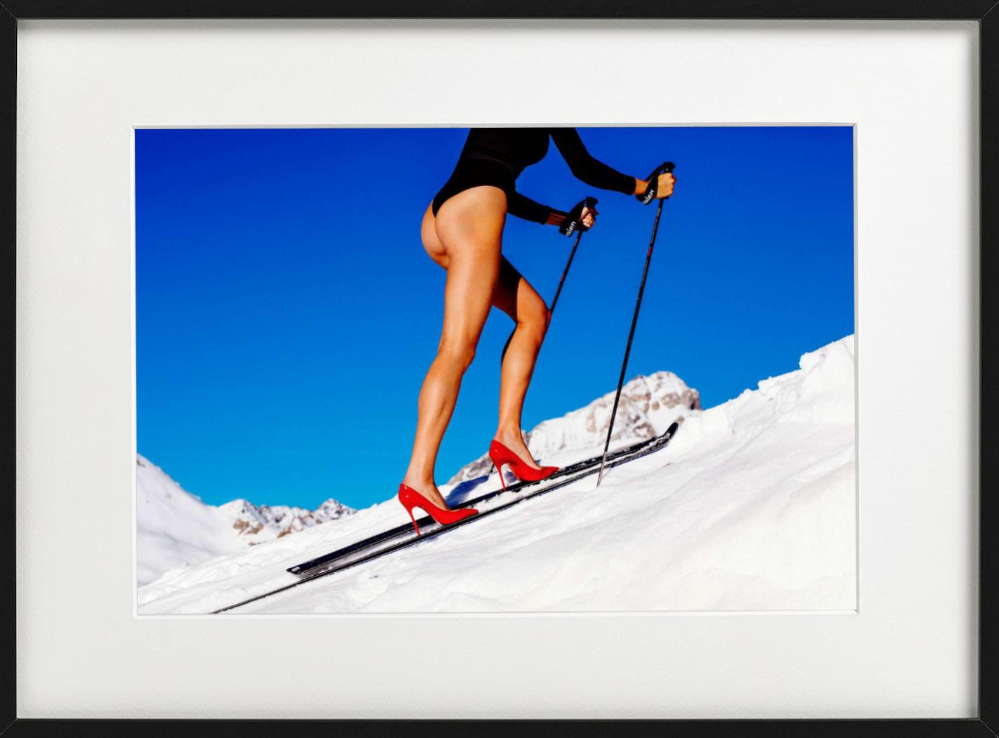 Backcountry  - Modella che scia con tacchi alti rossi, Fotografia Fine Art, 2018 - Color Photograph Blu di Tony Kelly