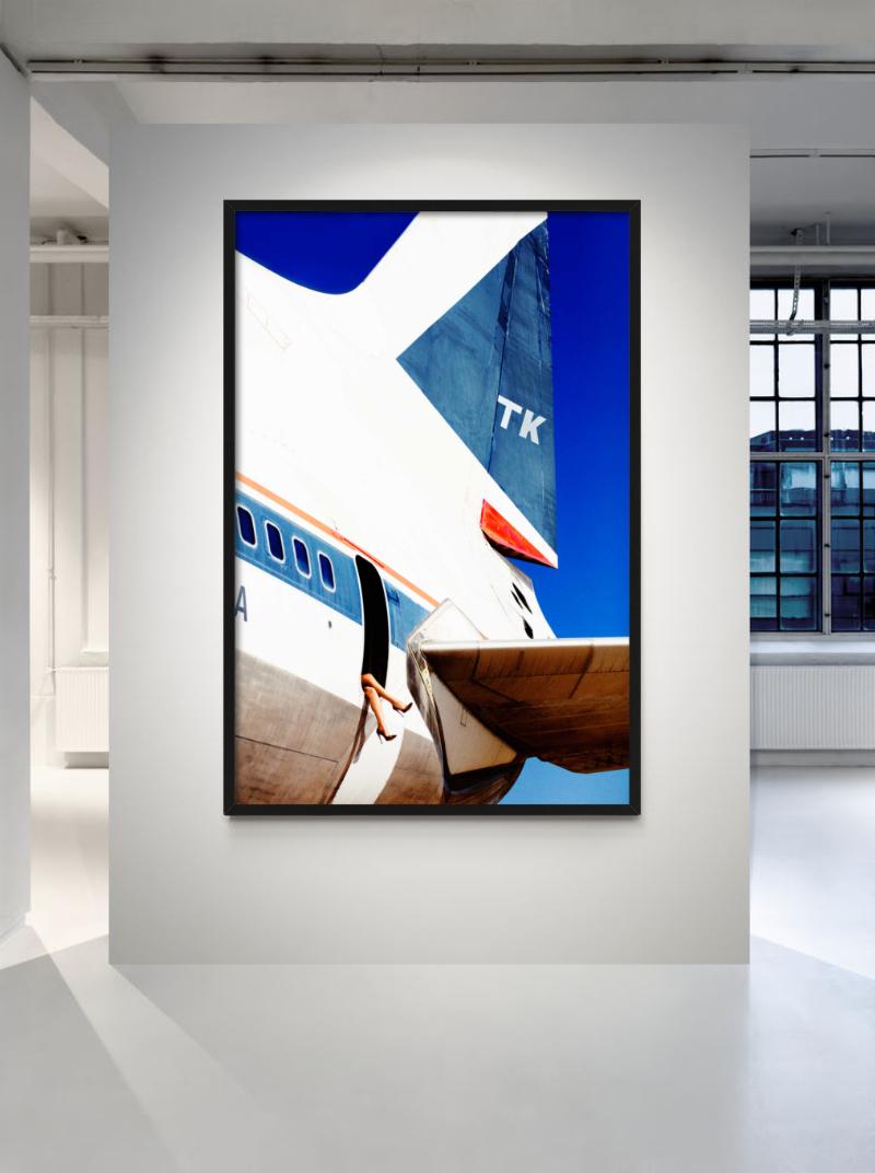 Elizabeth 4 - Female Legs dangling from Airplane door, Fine Art Photography 2016 - Purple Figurative Photograph by Tony Kelly