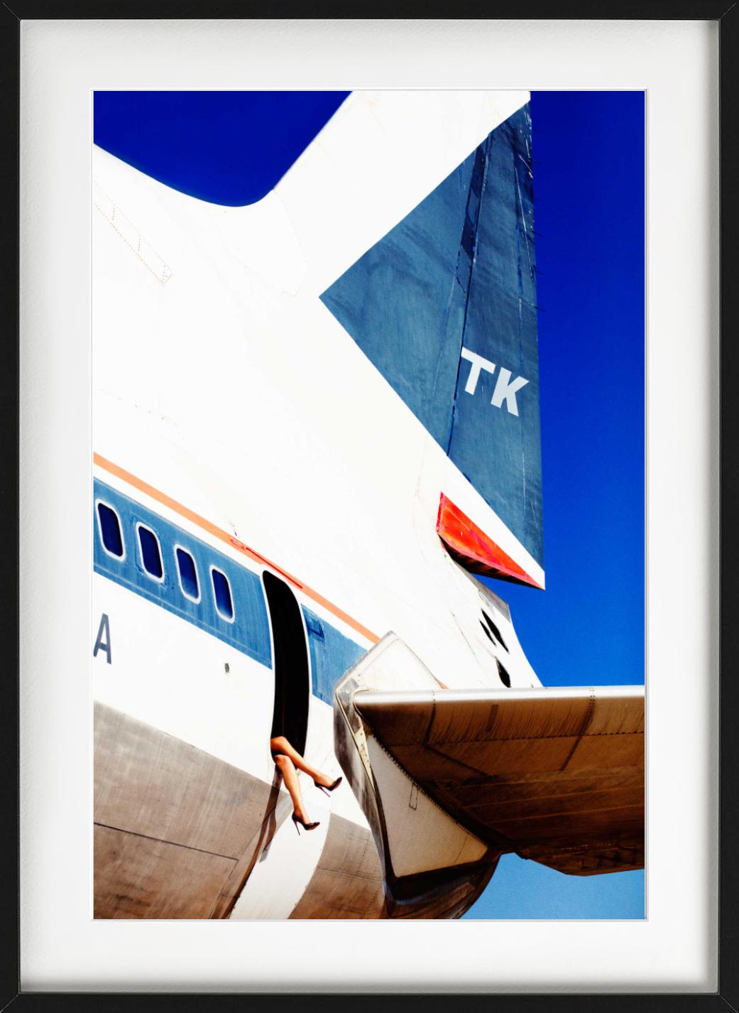 Elizabeth 4, a woman's legs, wearing high heels, dangling from an aircraft, photographed by Tony Kelly.

All prints are limited edition. Available in multiple sizes. High-end framing on request.

All prints are done and signed by the artist. The