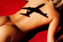 Flight 5 - nude portrait of a woman sunbathing overshadowed by an airplane