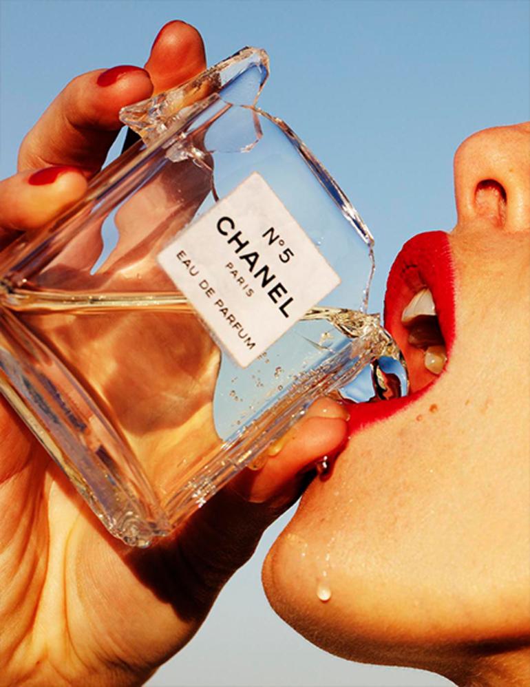 Tony Kelly Color Photograph - Hot Shot - portrait of a model with red lips drinking Chanel No 5 perfume