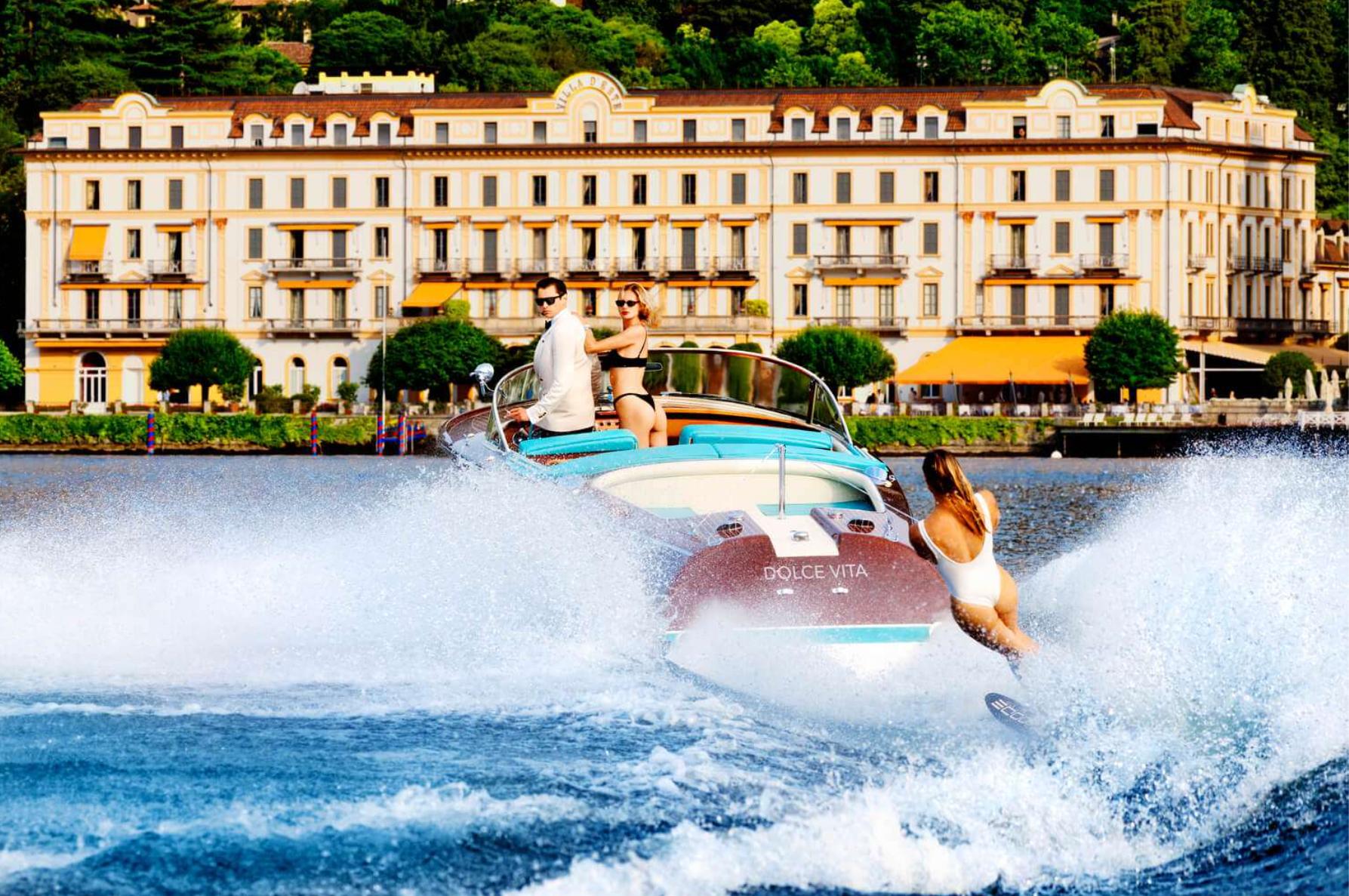 Tony Kelly Figurative Photograph - 'Lunch for Three at Two' - waterskiing at Lake Como, fine art photography, 2023