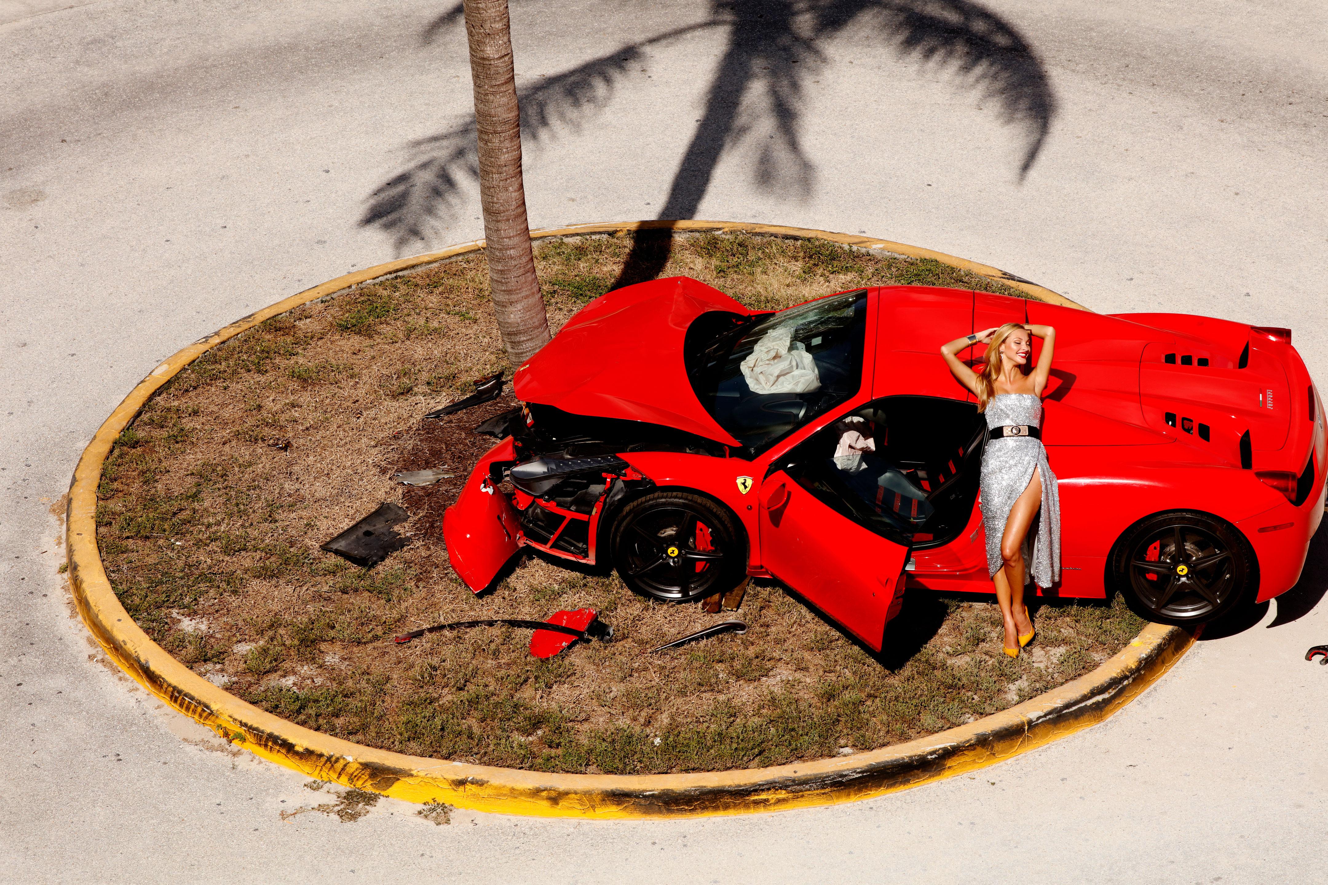 Miami Car Crash - Red Ferrari crashed on a Palmtree, fine art photography, 2019