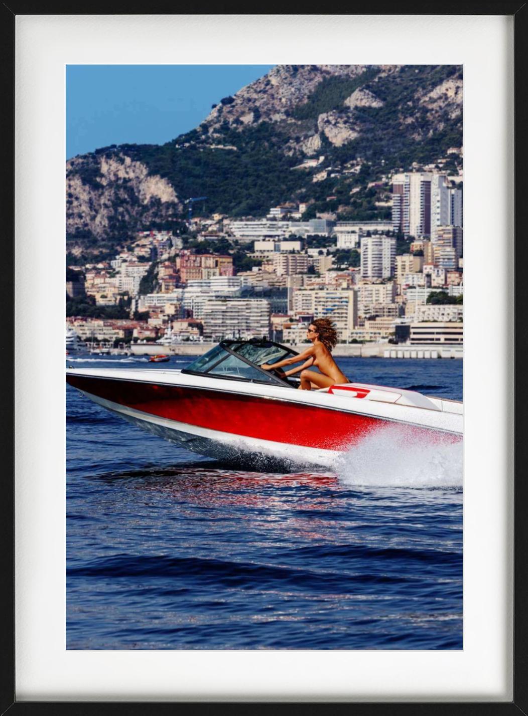 A Nude woman driving a speedboat along the coast of Monaco, photographed by Tony Kelly.

All prints are limited edition. Available in multiple sizes. High-end framing on request.

All prints are done and signed by the artist. The collector receives