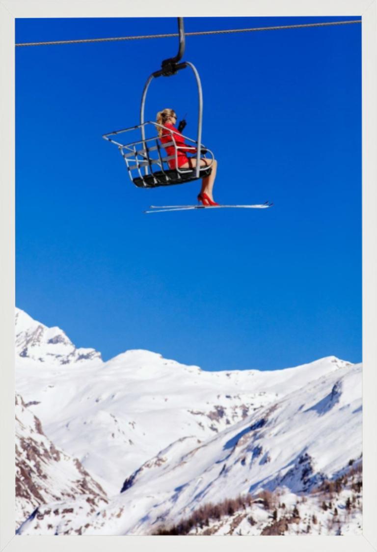 Ski Patrol - Model in Red sitting in a Chairlift, Fine Art Photography, 2019 - Blue Figurative Photograph by Tony Kelly
