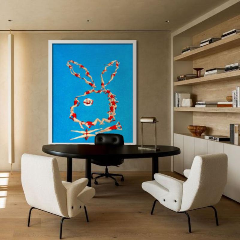 Synchronized swimmers in red bathing suits forming a Playboy bunny in a blue pool, photographed by Tony Kelly in 2013.

All prints are limited edition. Available in multiple sizes. High-end framing on request.

All prints are done and signed by the