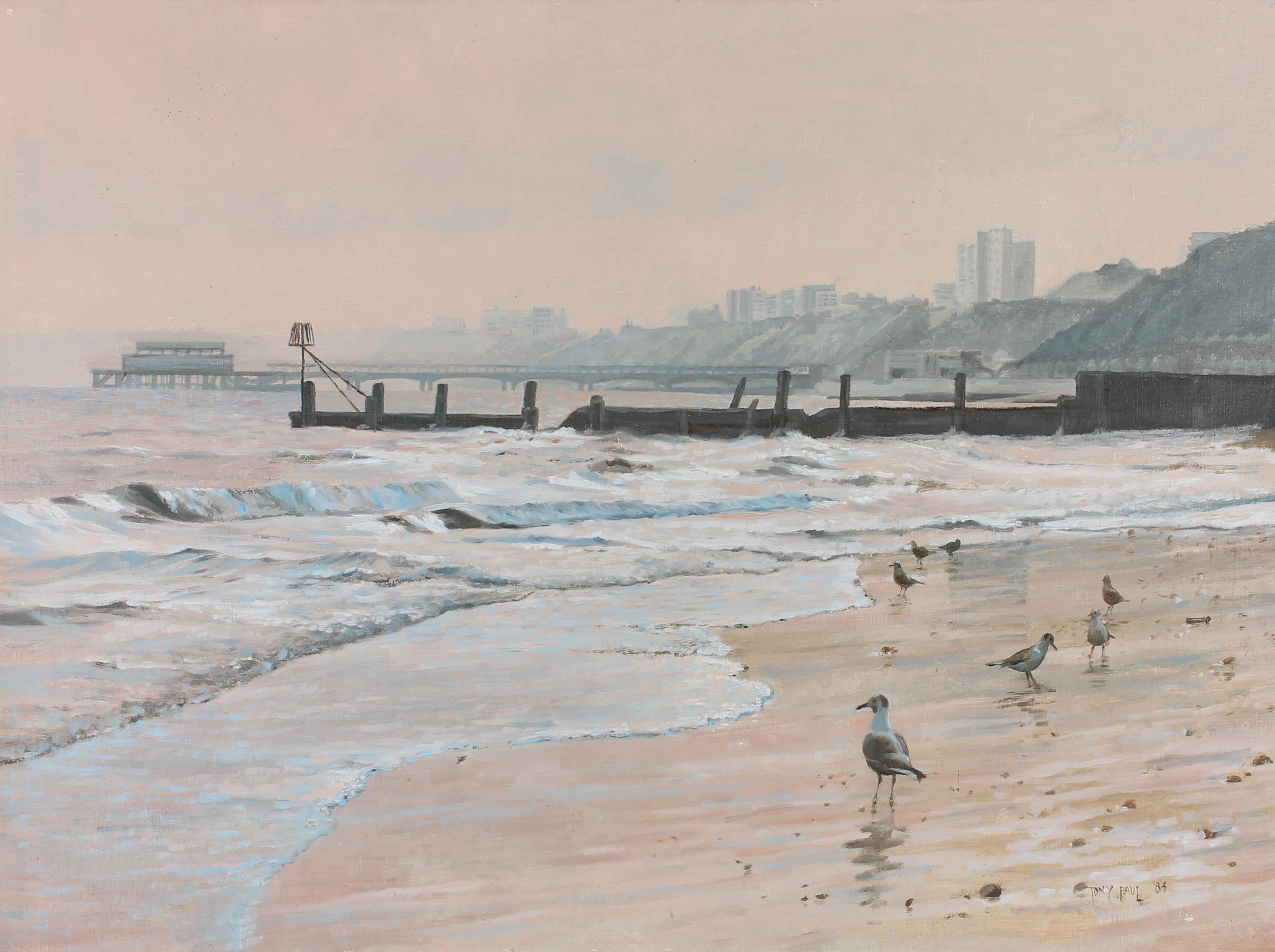 A charming coastal scene in oil from the late 20th Century, showing a flock of seagulls on the wet sands of Boscombe beach at twilight. The artist has signed and dated to the lower right corner and the painting has been presented in a 20th Century