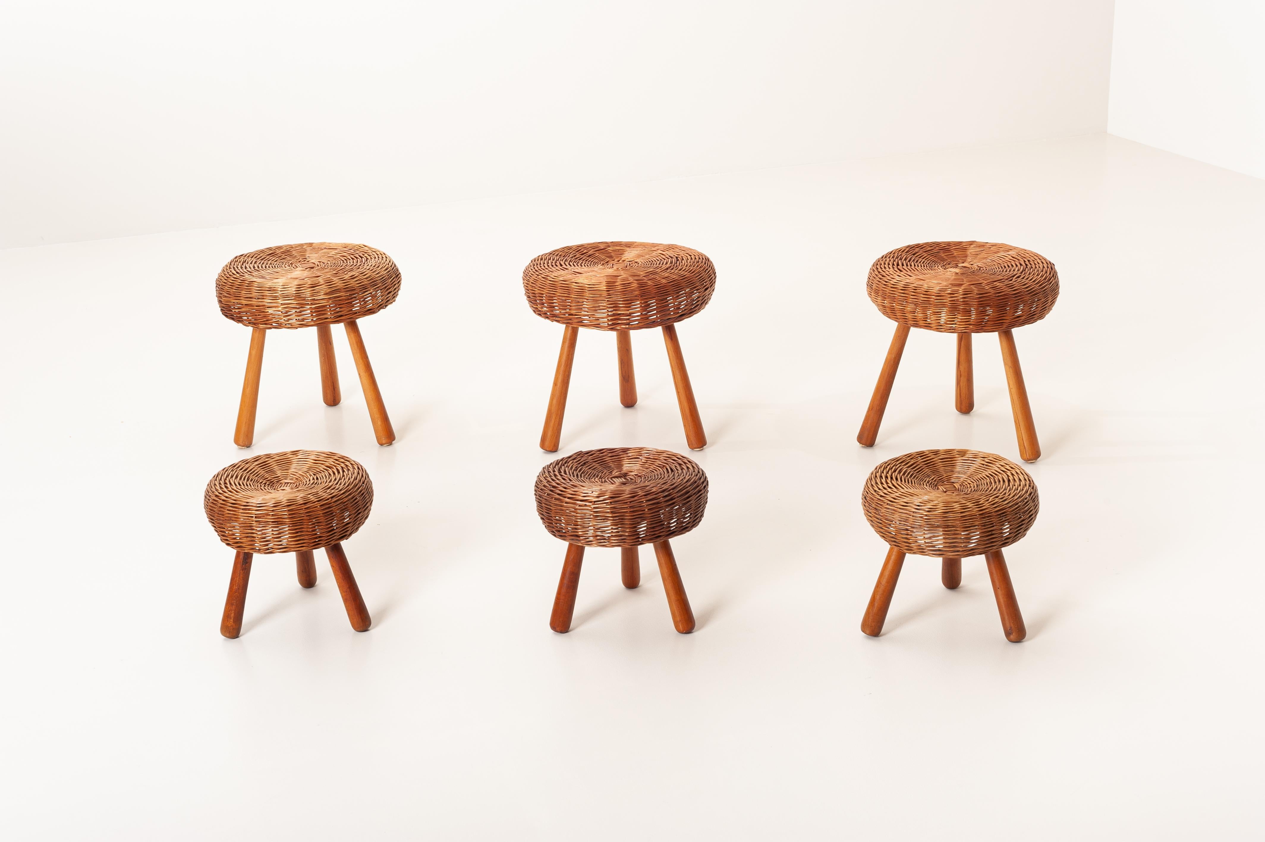 Set of three low stools or footstools with a handwoven wicker top and solid beech legs attributed to the famous American designer Tony Paul.

Produced in the late 1950s these stools are in their original condition and refinished to last for the