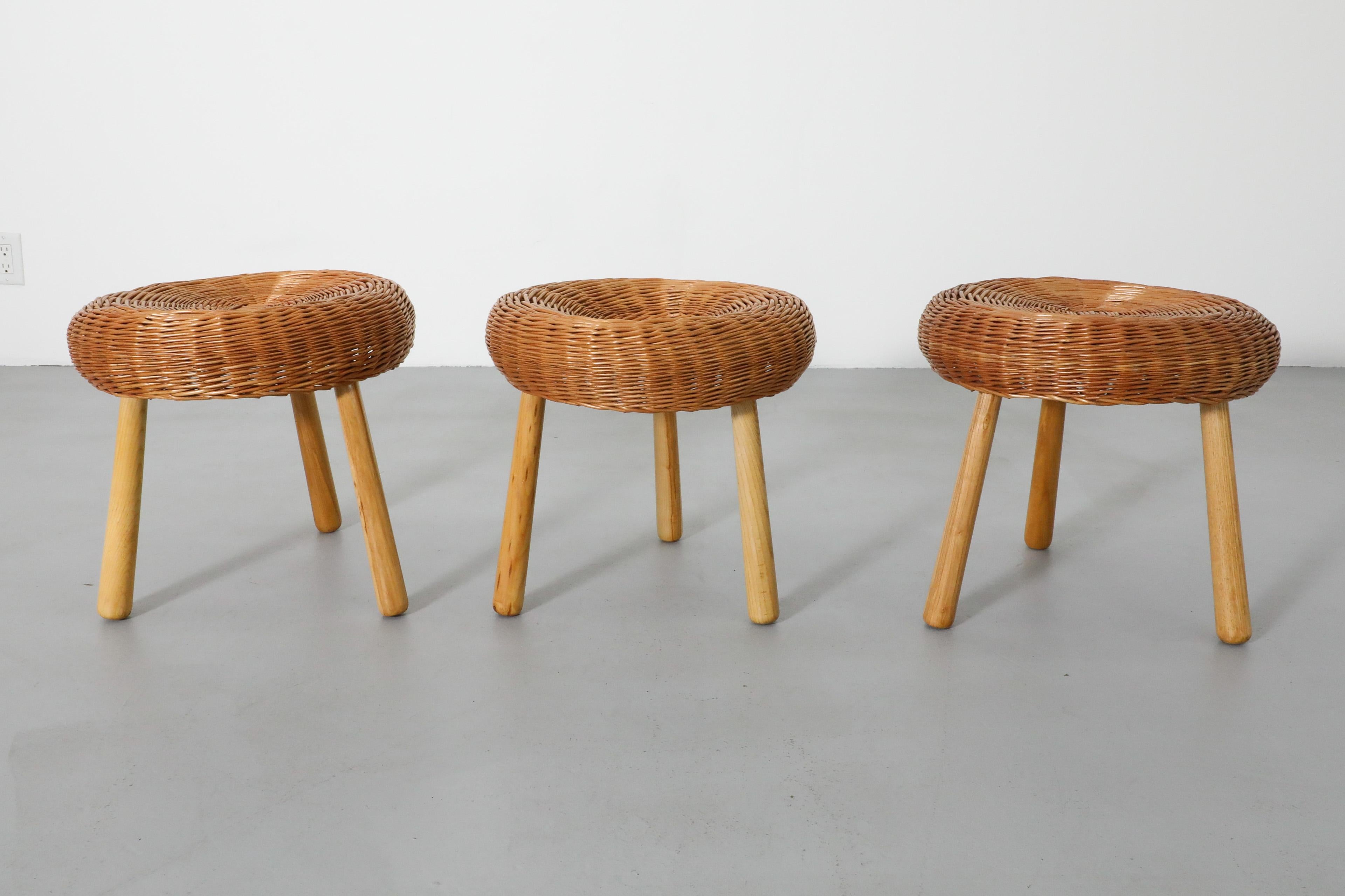 Mid-20th Century Tony Paul Attributed Woven Rattan Tripod Stools with Tapered Solid Wood Legs For Sale