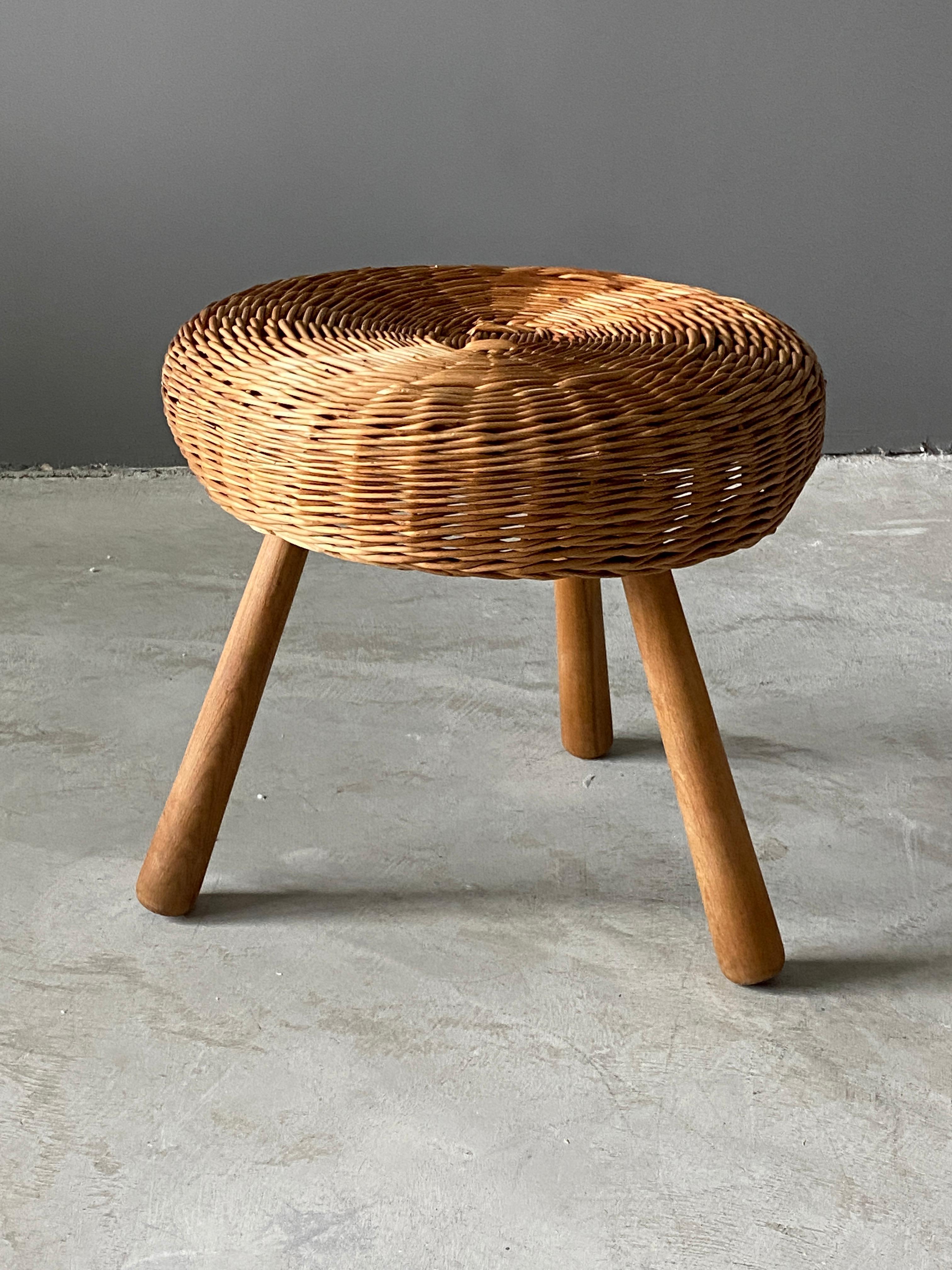 *Specifications stated in client conversation*

A large version stool, design attributed to Tony Paul. Features an interesting mix of rattan and finely carved solid wood.

Other designers of Minimalist stools of the period include Charlotte