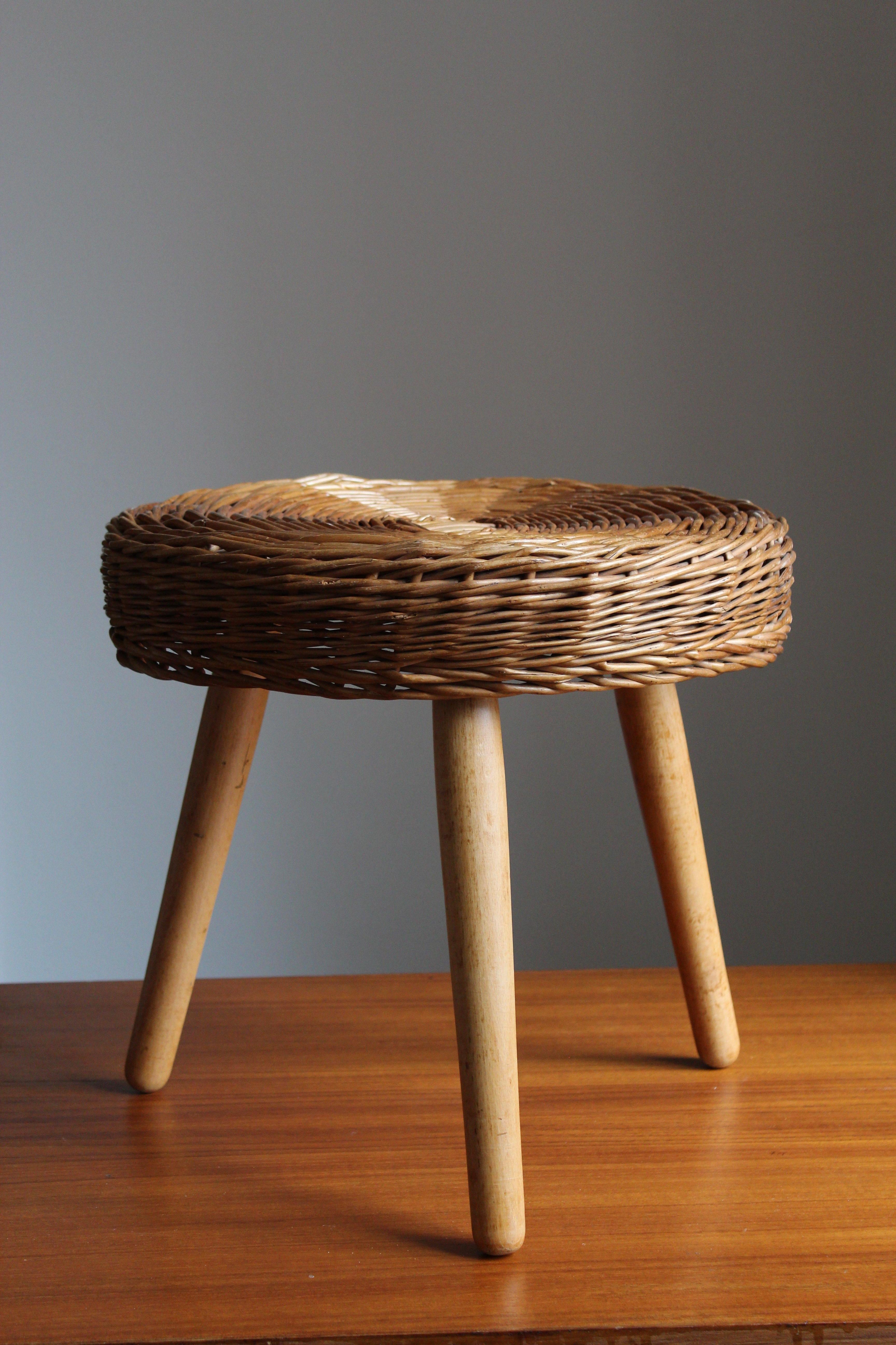 A stool, design attributed to Tony Paul. Features an interesting mix of rattan and finely carved solid wood.

Other designers of Minimalist stools of the period include Charlotte Perriand, Pierre Chapo, Isamu Noguchi, Eero Arnio, and Sori Yanagi.