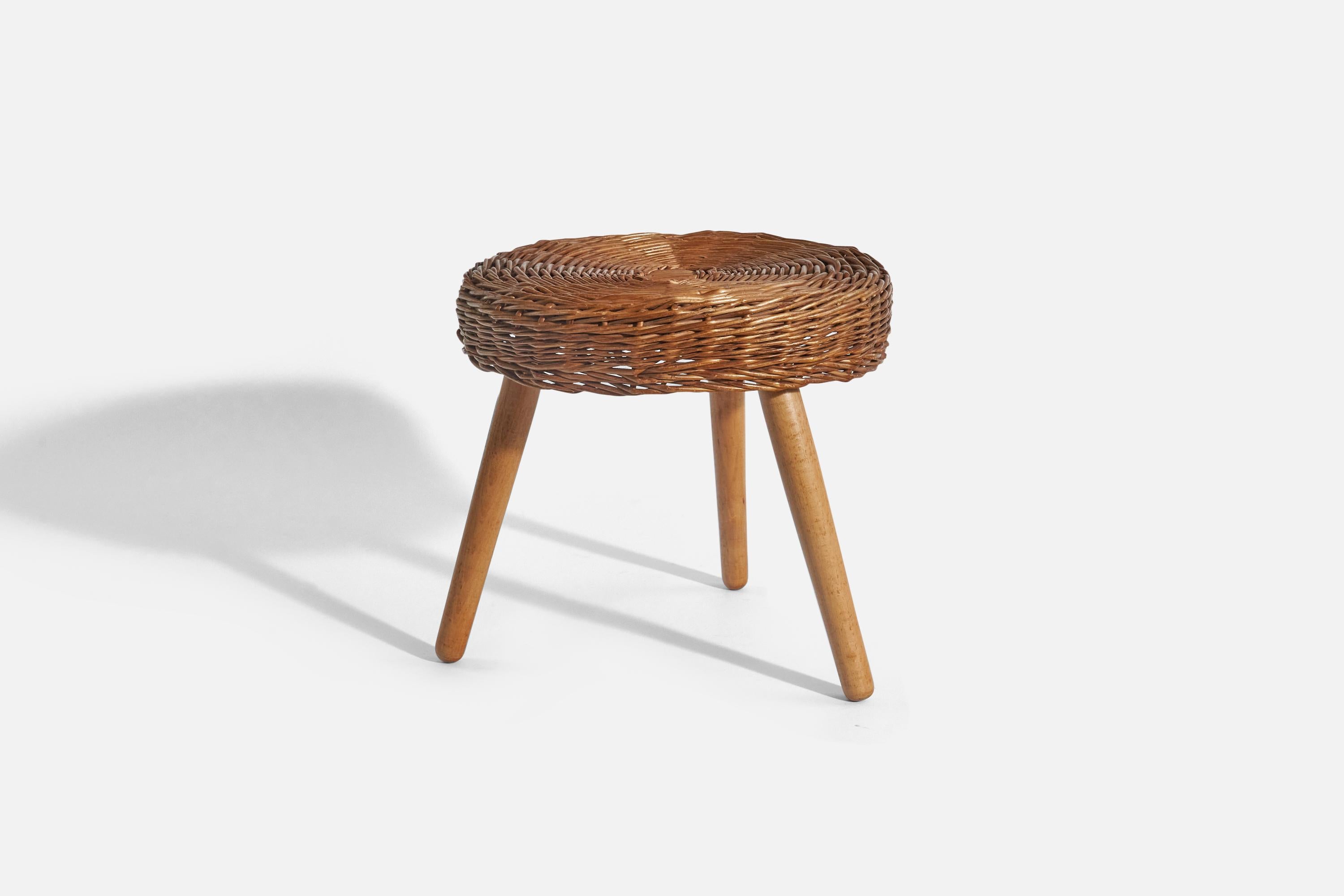 A wicker and wooden stool; design and production attributed to Tony Paul, United States, 1950s.
  