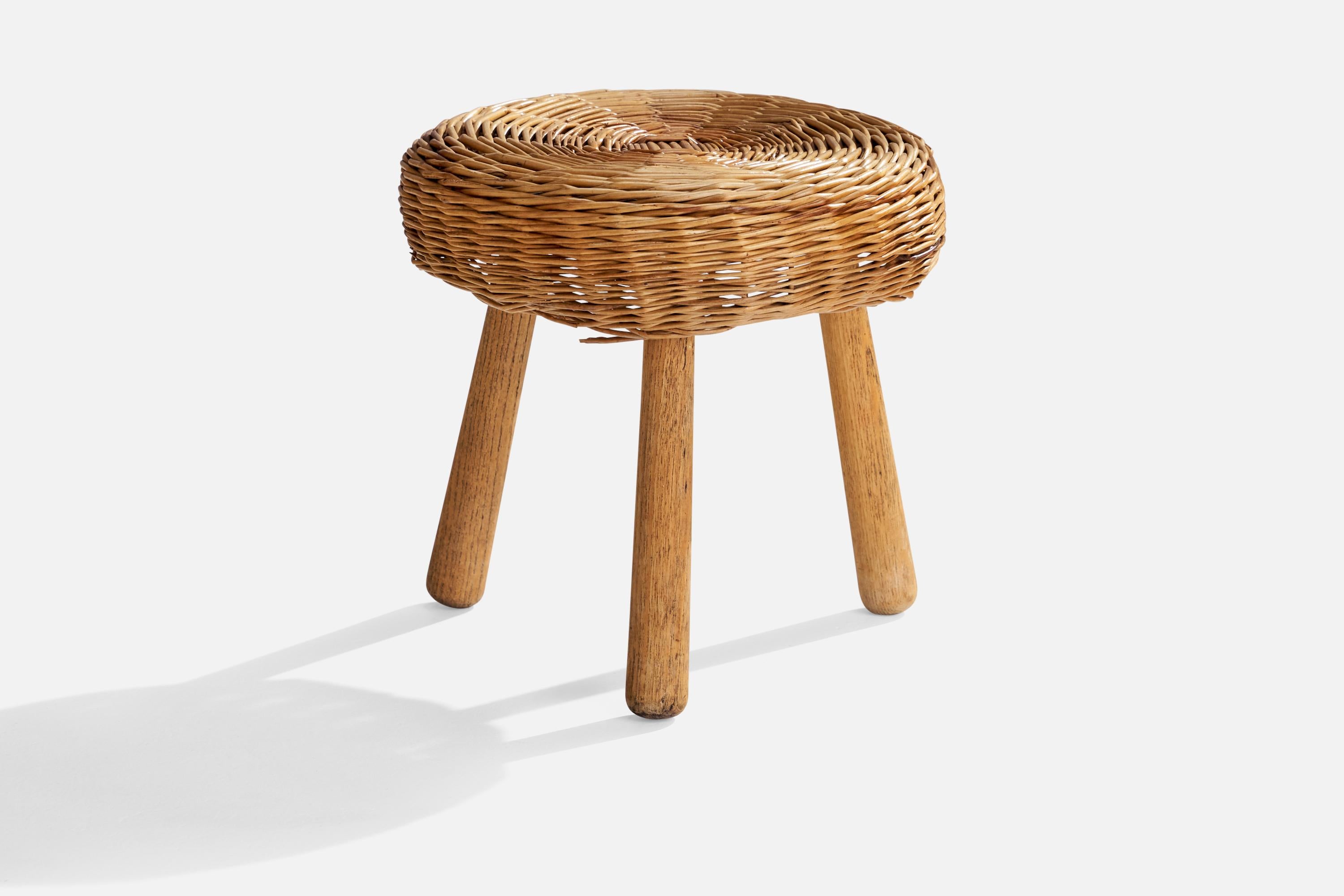 A wood and rattan stool attributed to Tony Paul, USA, c. 1950s.

seat height 11.25.