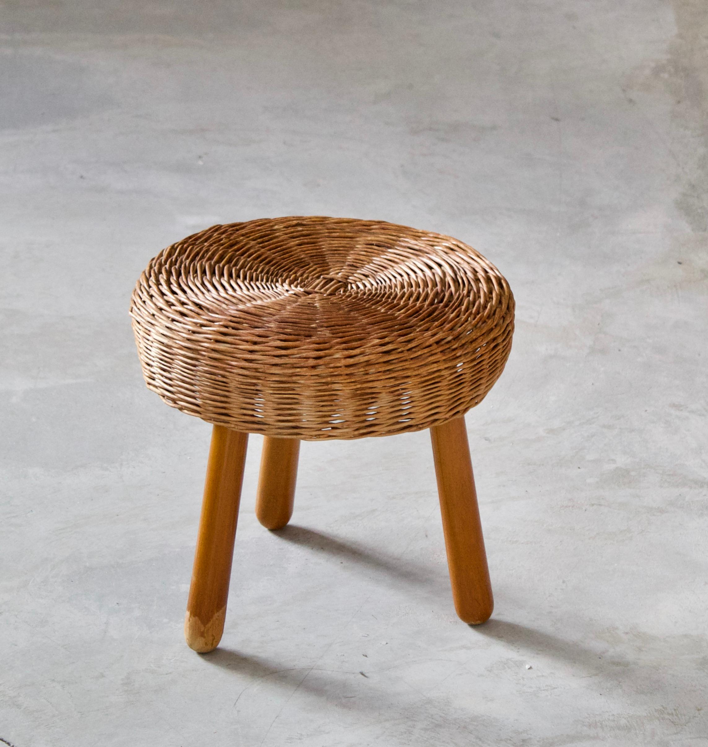 A stool, design attributed to Tony Paul. Features an interesting mix of rattan and finely carved solid wood.

Other designers of Minimalist stools of the period include Charlotte Perriand, Pierre Chapo, Isamu Noguchi, Eero Arnio, and Sori Yanagi.