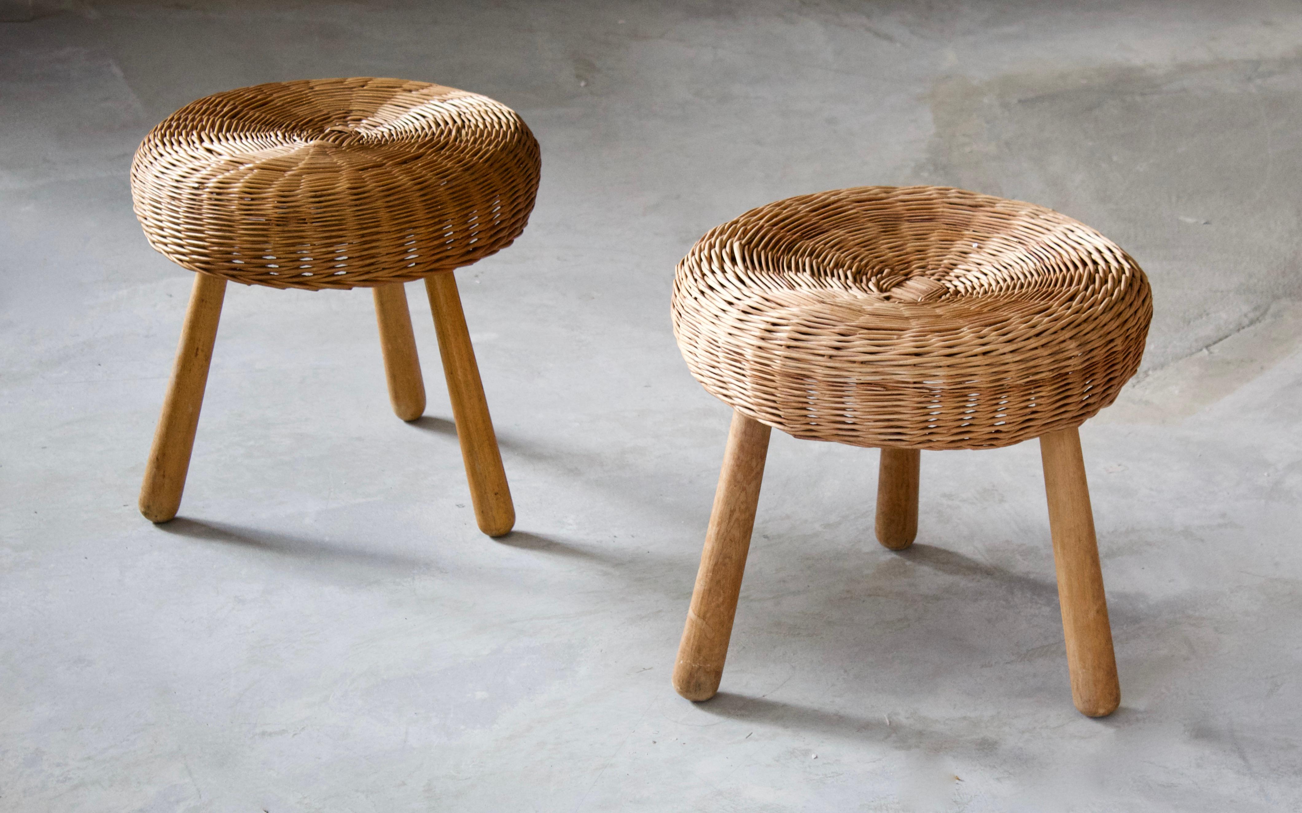 A pair of stools, design attributed to Tony Paul. Features an interesting mix of rattan and finely carved solid wood.

Other designers of Minimalist stools of the period include Charlotte Perriand, Pierre Chapo, Isamu Noguchi, Eero Arnio, and Sori