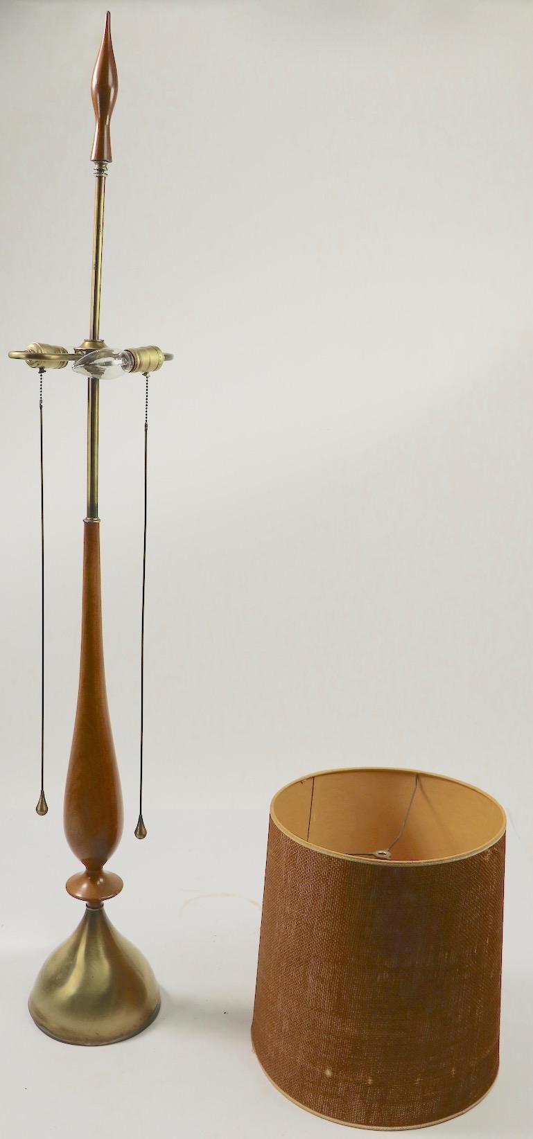 Exceptional elongated mid century table lamp designed by Tony Paul for Westwood Industries. This example is in very good, original and working condition, shade included but shows minor damage.
Measures: Diameter of base 8 x diameter of Shade 13.5 x