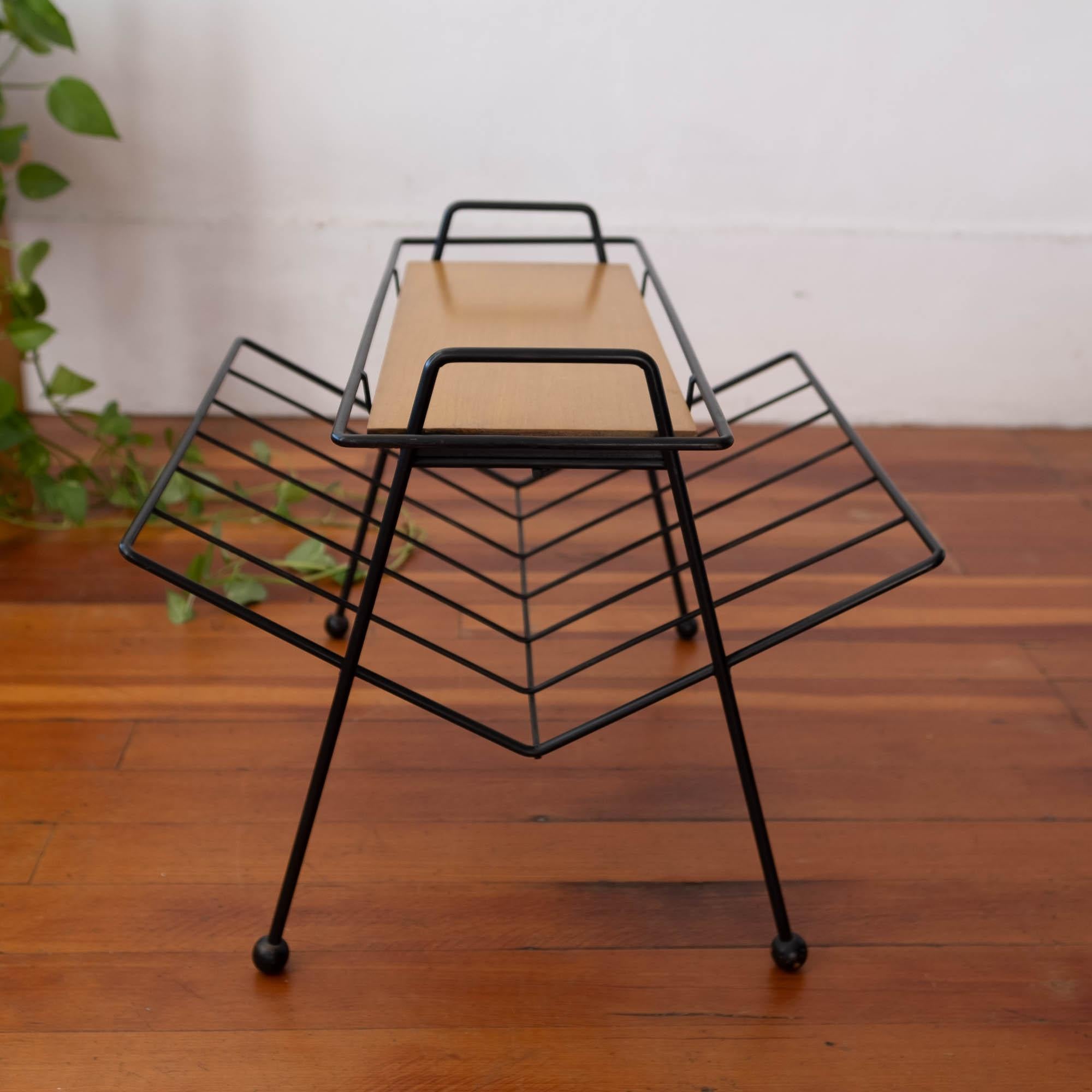 Tony Paul for Woodlin-Hall “Tempo Group” occasional table with magazine Stand and removable wood tray. Iron frame with wooden ball feet, USA, 1950s.