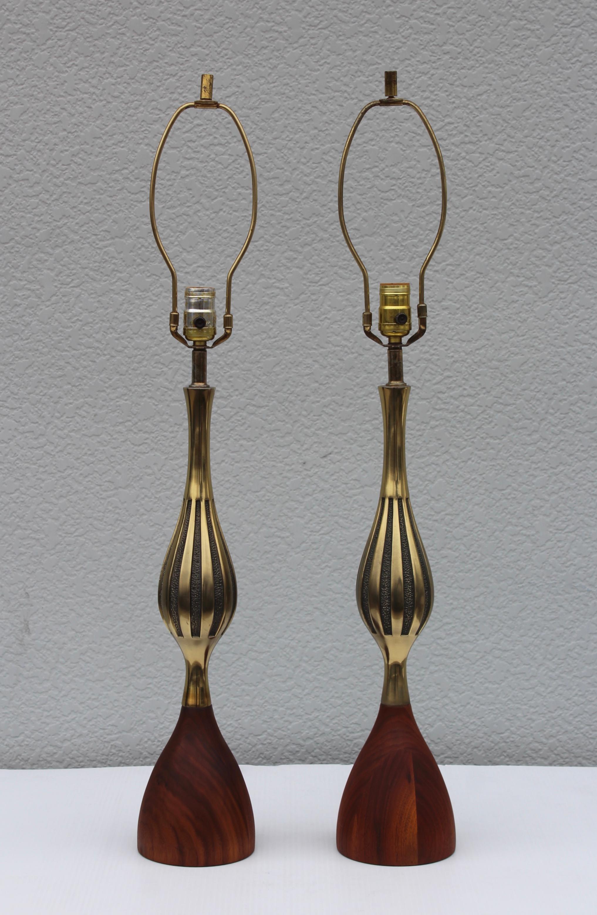 1960s Mid-Century Modern brass and walnut table lamps designed by Tony Paul for Westwood.

Height to light socket 24